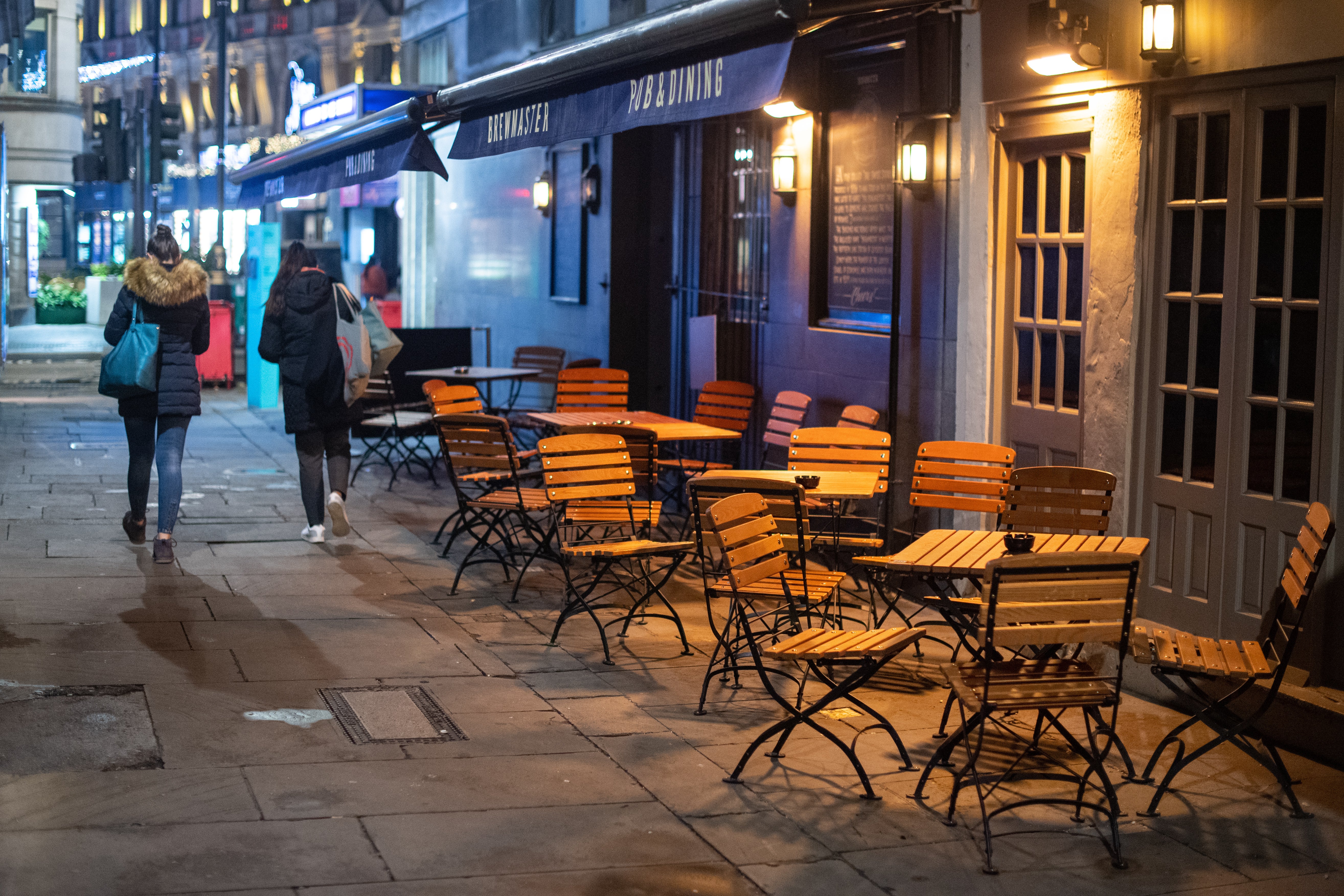 Empty seating outside a pub near Charing Cross, London (Dominic Lipinski/PA)