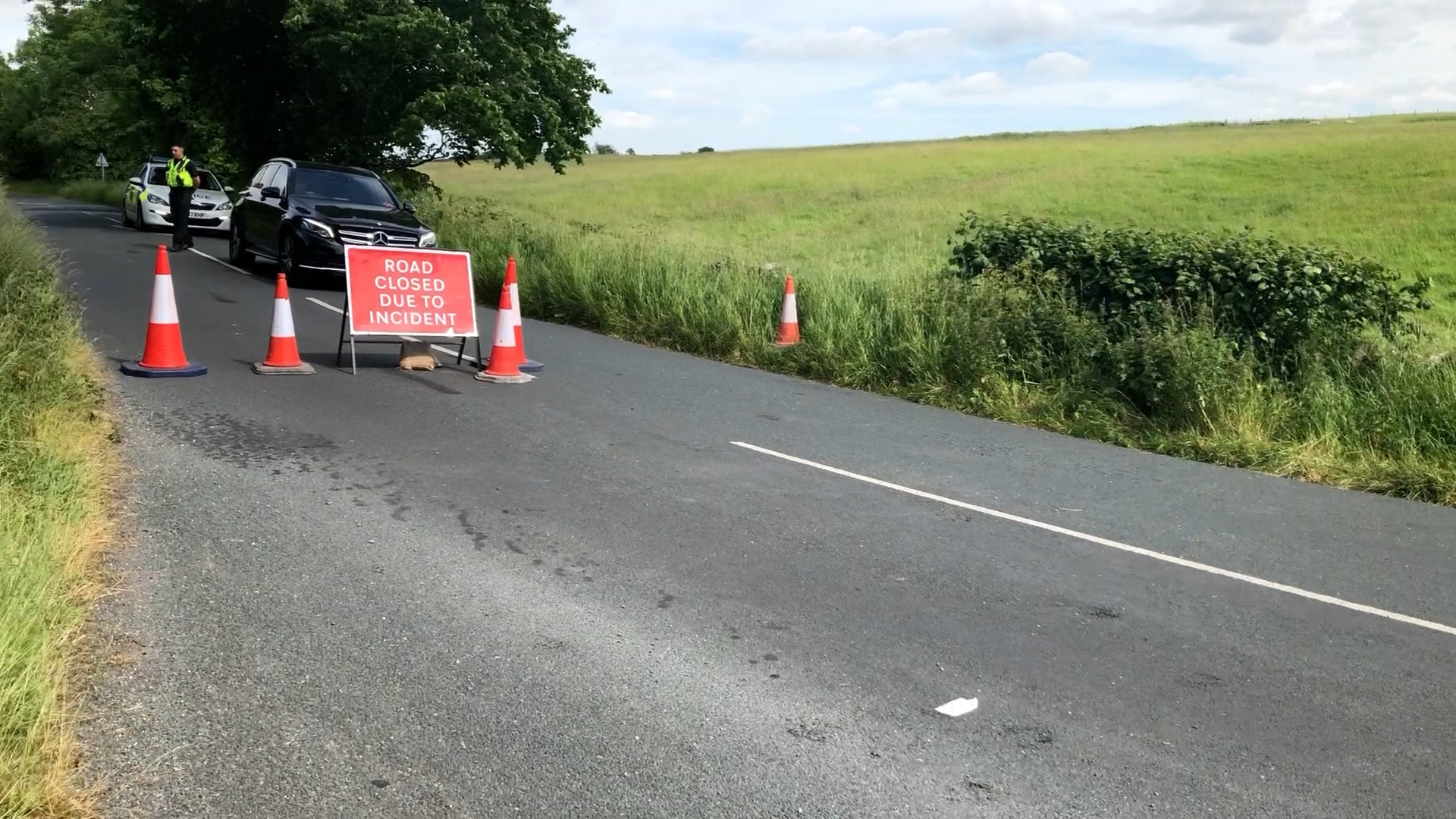 A road closed by police near the scene of a helicopter crash in a field near Burton in Lonsdale, North Yorkshire (Kim Pilling/PA)