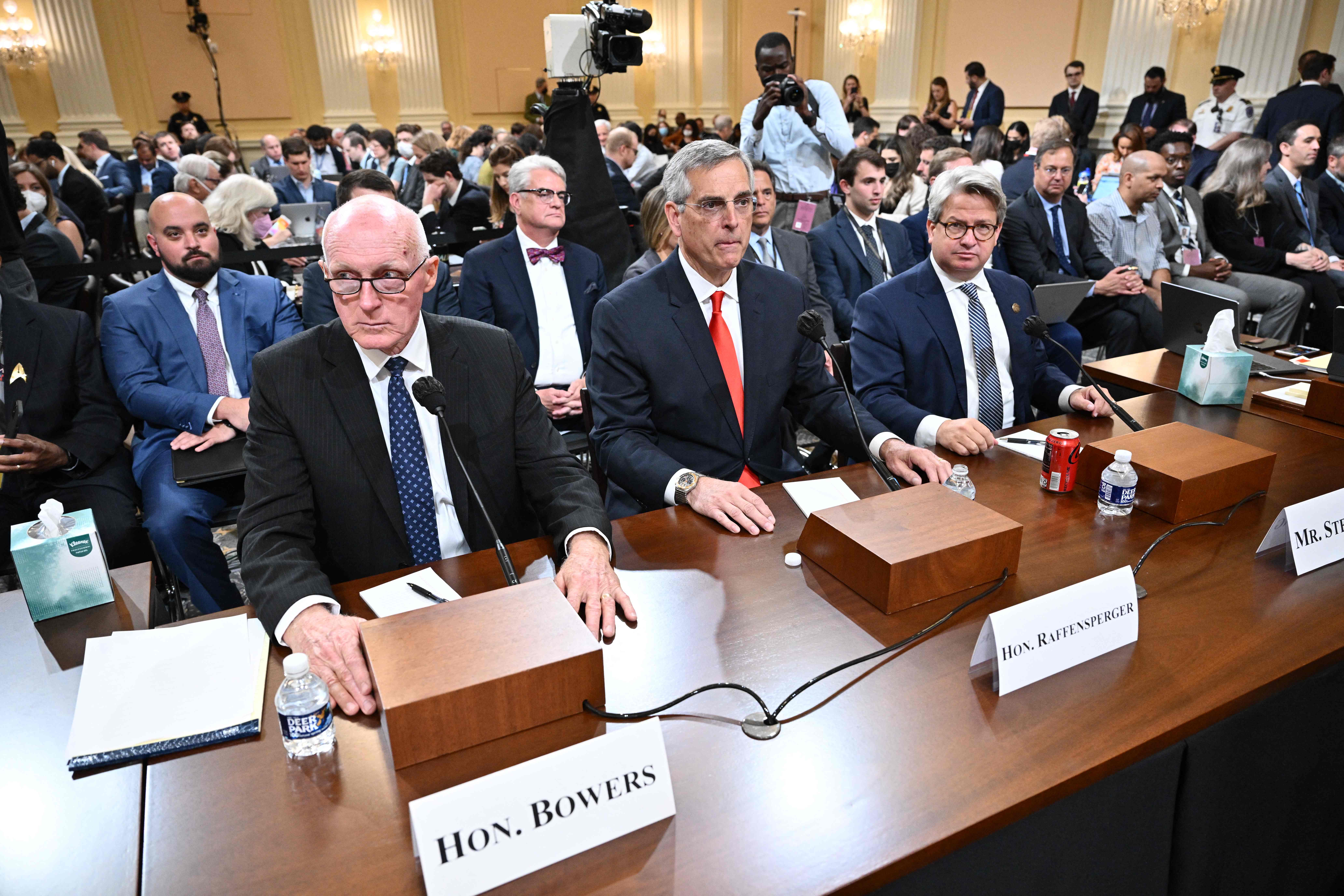 Arizona state house speaker Rusty Bowers (left), Georgia secretary of state Brad Raffensperger (centre) and chief operating officer for the Georgia secretary of state Gabriel Sterling prepare to testify