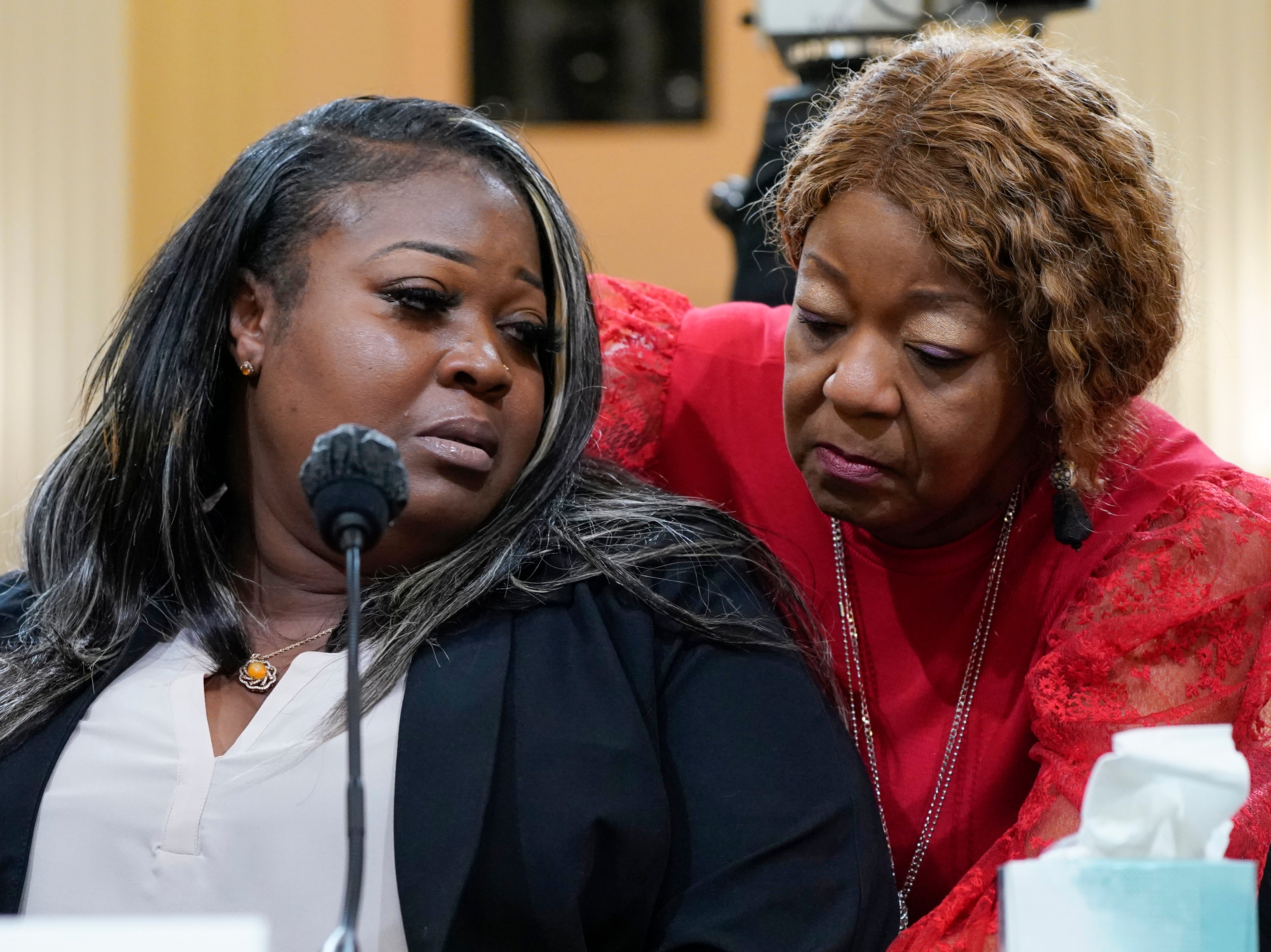 Wandrea "Shaye" Moss, a former Georgia election worker, is comforted by her mother Ruby Freeman