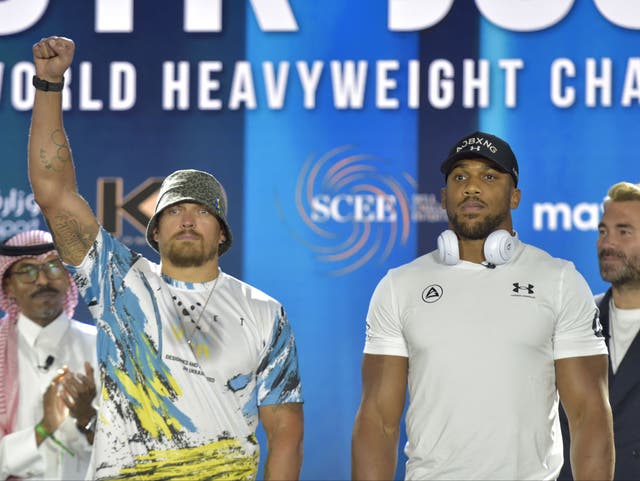 <p>Anthony Joshua (centre-right) and Oleksandr Usyk (centre-left) clash again in August</p>