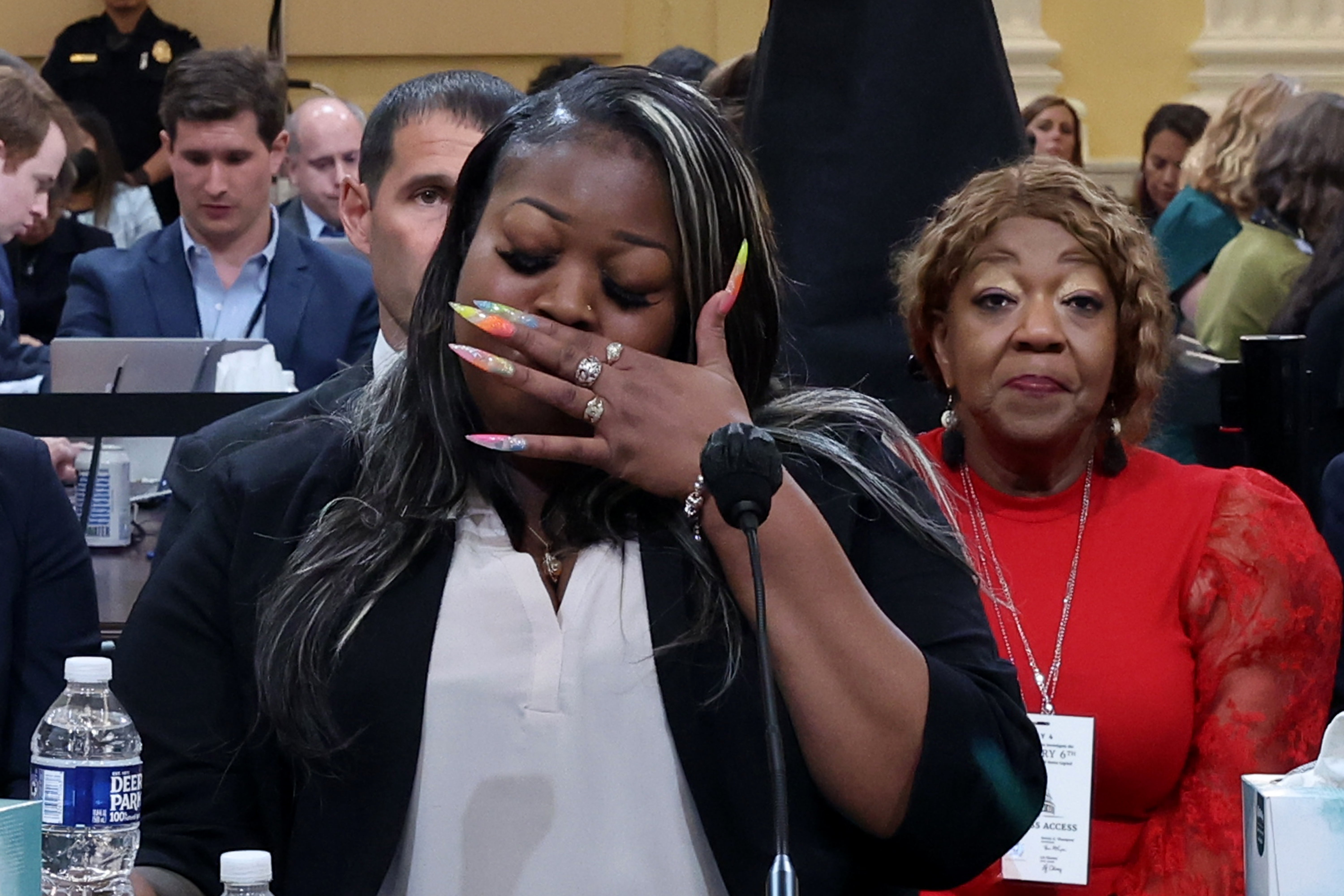 Shaye Moss, former Georgia election worker, becomes emotional while testifying as her mother Ruby Freeman watches during the fourth hearing held by the Select Committee to Investigate the January 6th Attack on the U.S. Capitol on 21 June 2022.