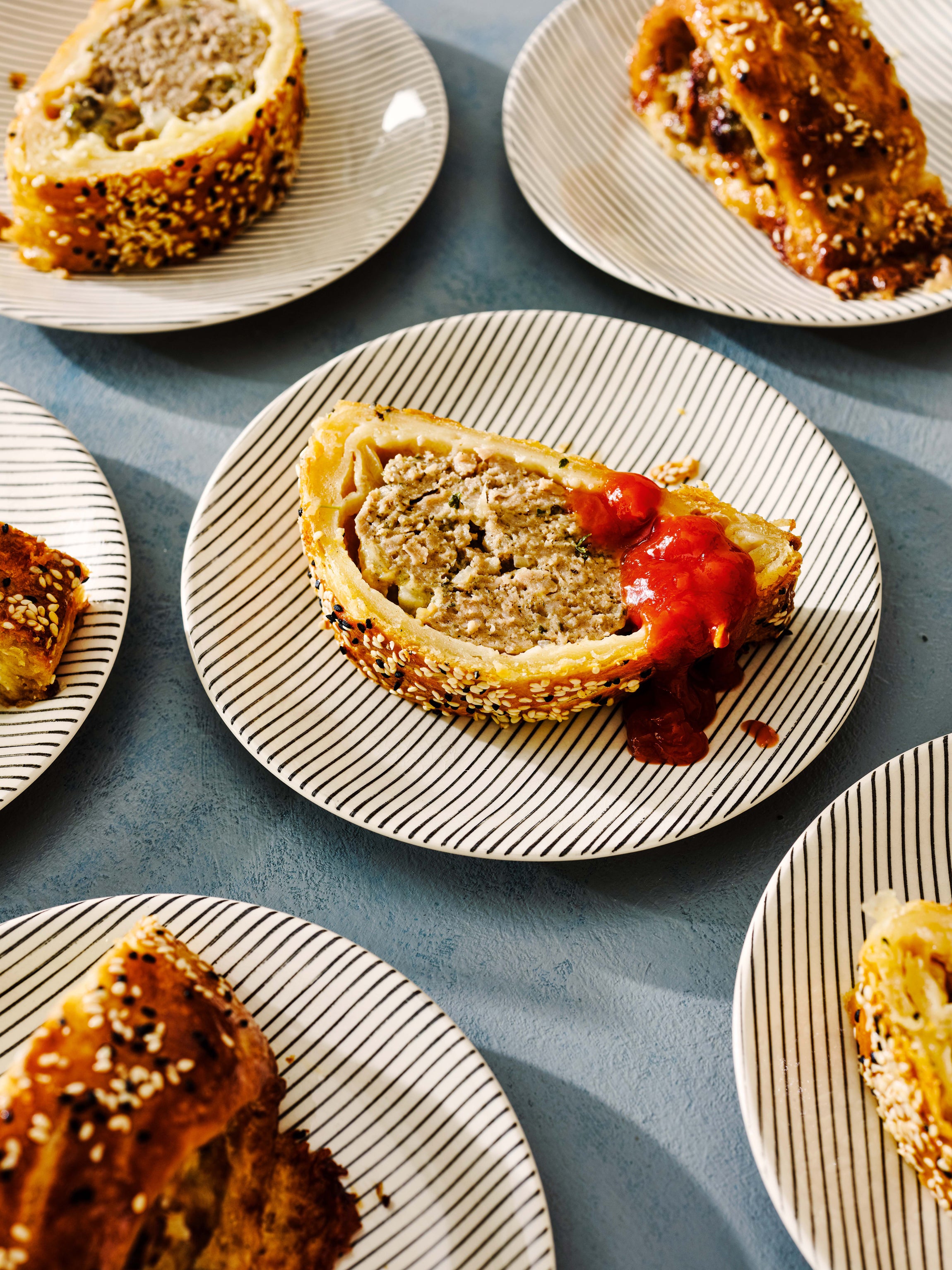 The addition of Stilton gives these sausage rolls a bit of a kick