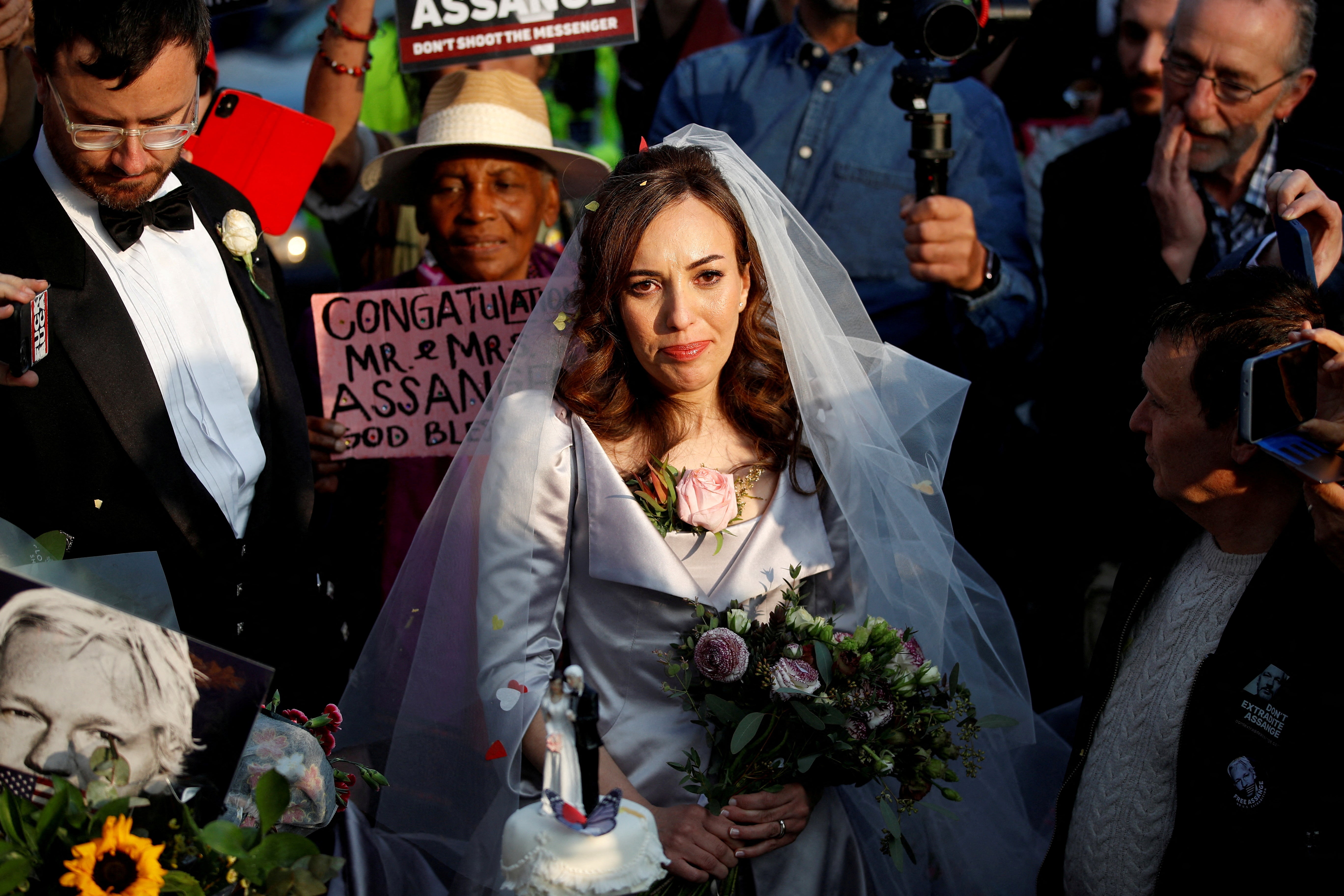 Stella Moris stands next to her wedding cake after departing HMP Belmarsh prison