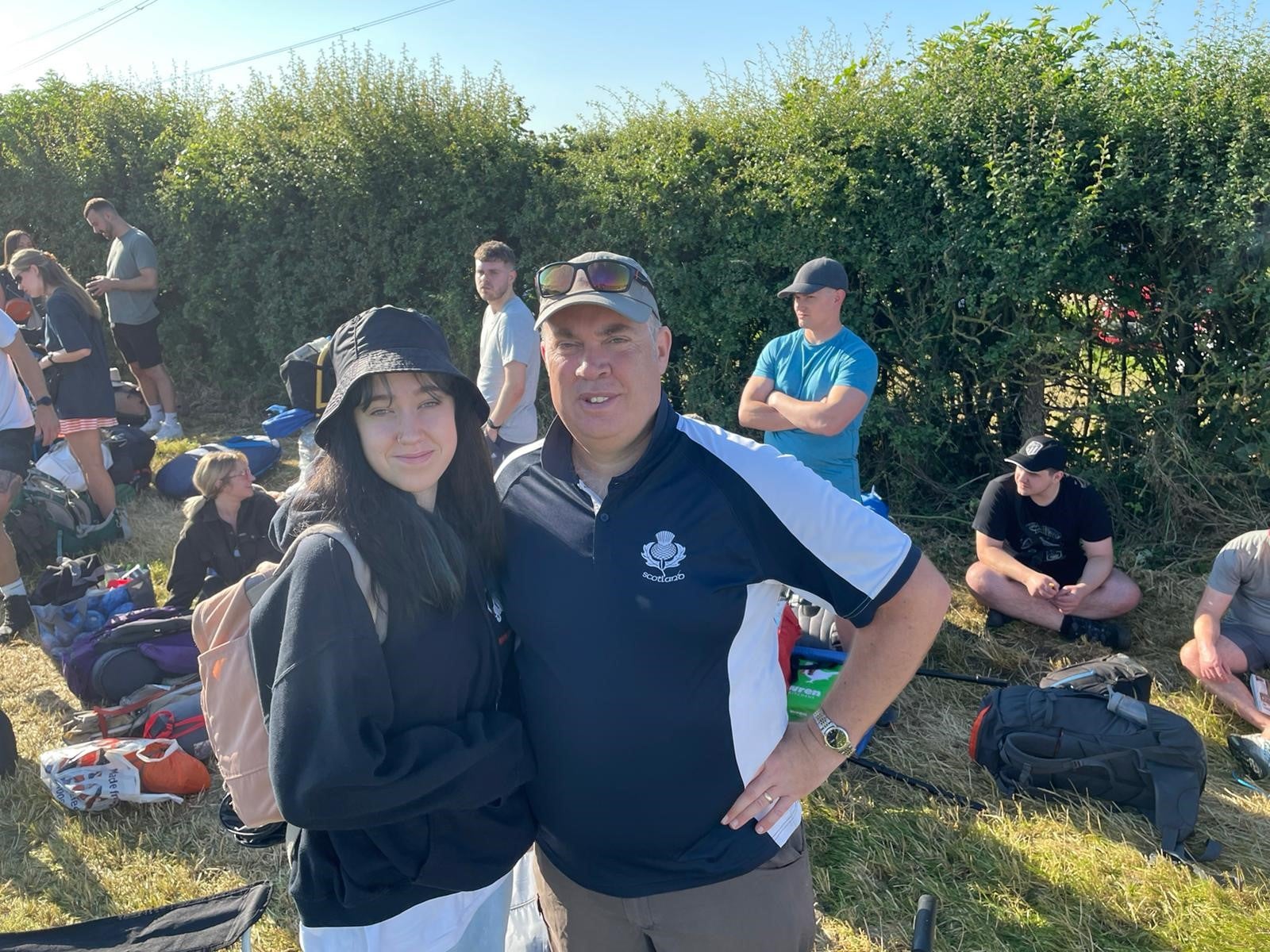 Mark Lawrie and his daughter Bethan waiting to enter Glastonbury Festival (PA)