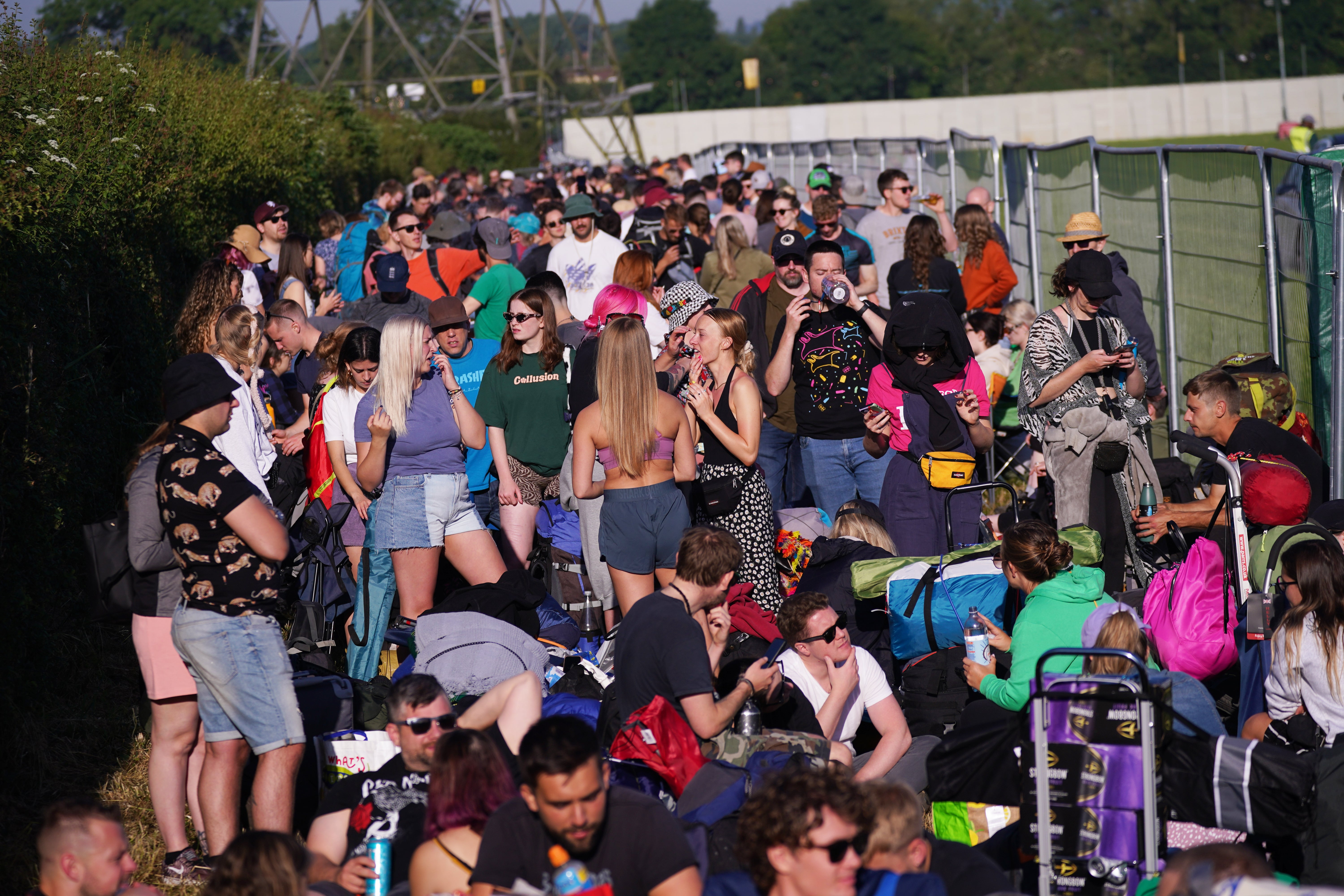 Festival-goers queuing for entry on the first day of Glastonbury at Worthy Farm in Somerset (Yui Mok/PA)