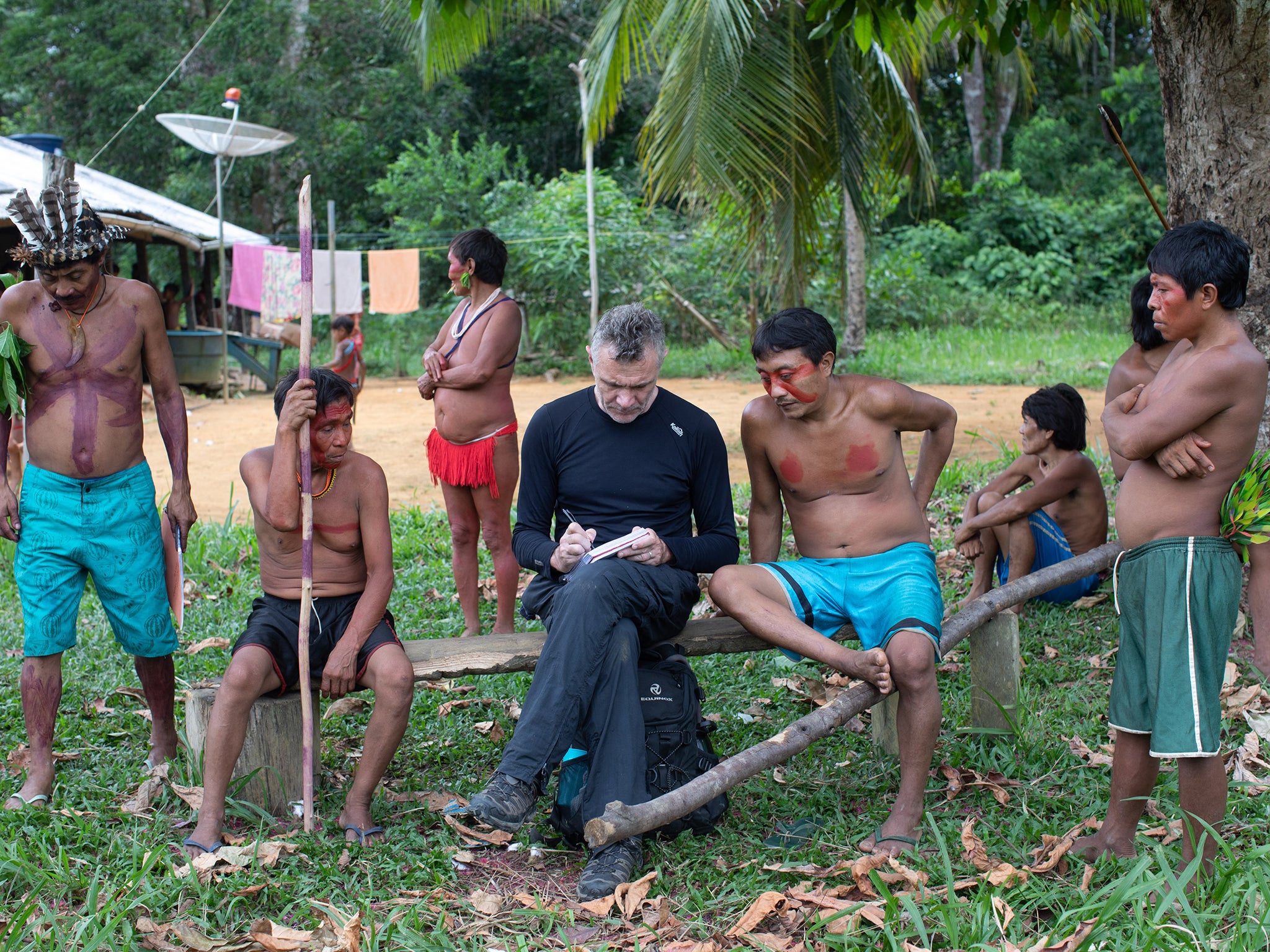 Phillips takes notes as he talks with indigenous people at the Aldeia Maloca Papia, Roraima State, Brazil, in November 2019