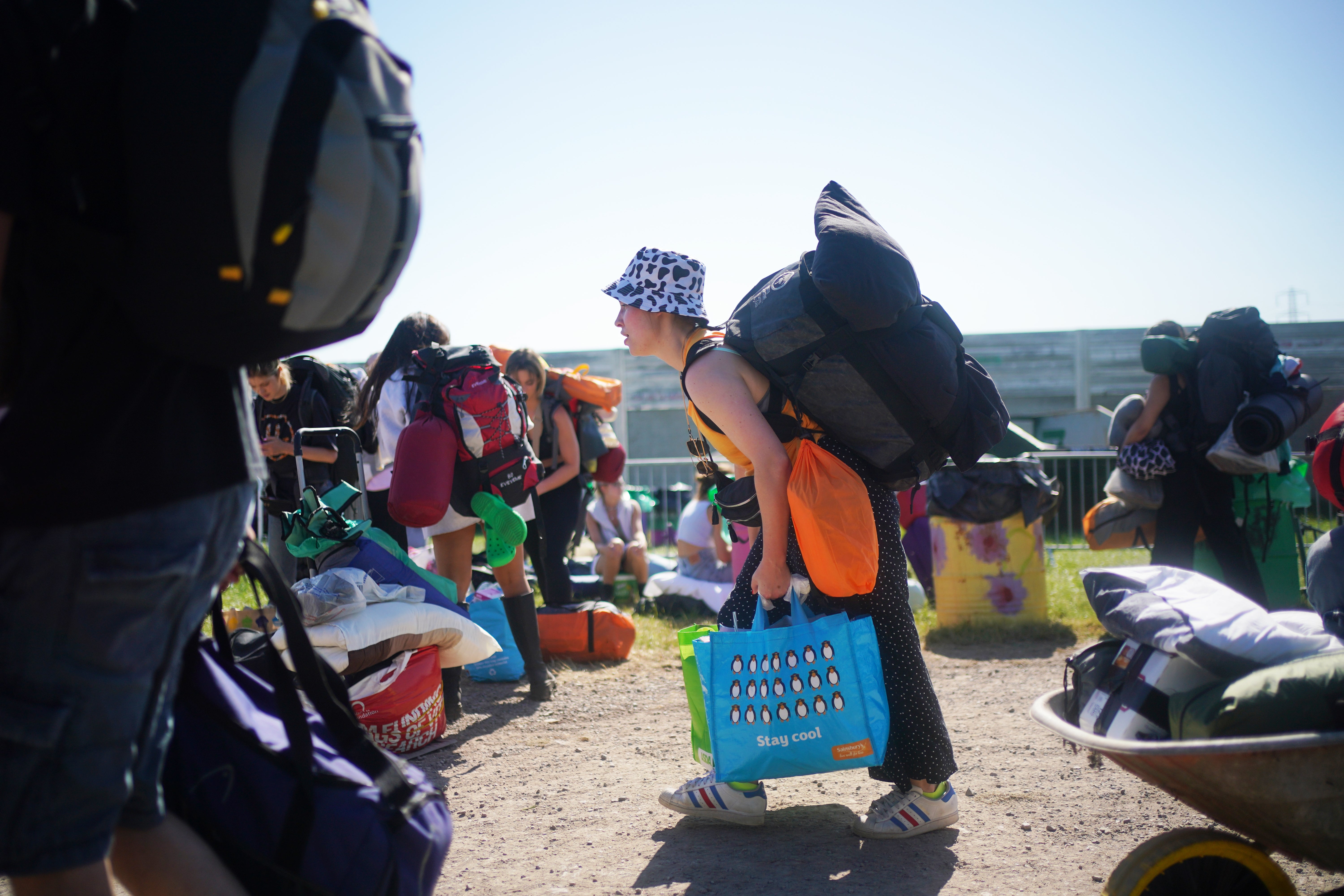 People arrive on the first day of the Glastonbury Festival at Worthy Farm in Somerset (Yui Mok/PA)