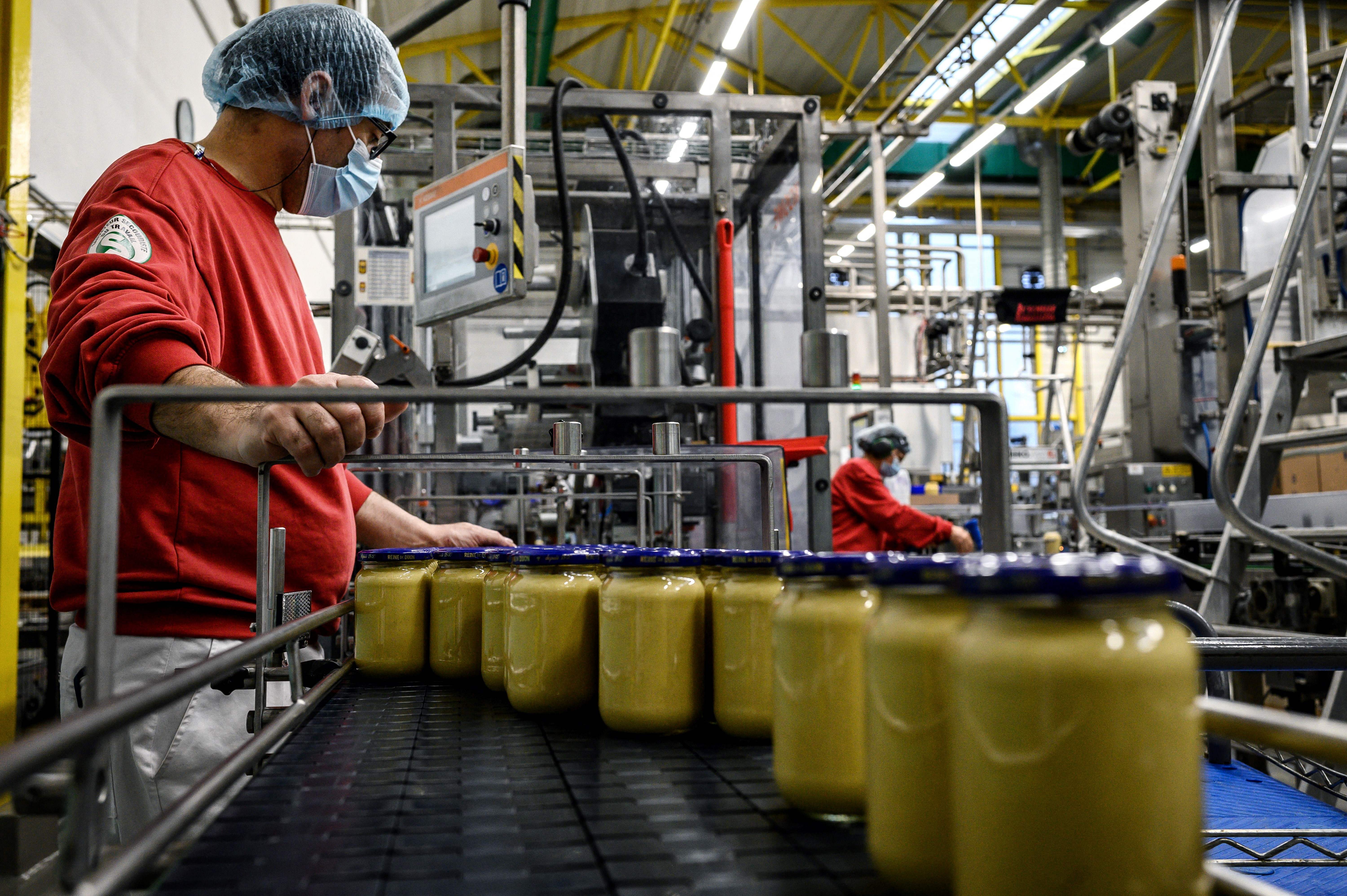 Workers at a Dijon mustard factory in France last year