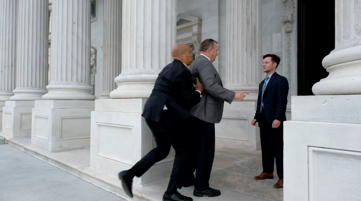 The New Jersey senator scoops up his Montana counterpart on the steps of the Capitol in a recent political ad