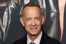 Tom Hanks says it’s an ‘honour’ to crash weddings, after being repeatedly photographed with newly-wed couples