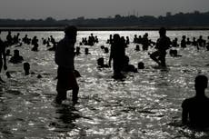 Man hit and dragged out of holy river for kissing partner while bathing in India
