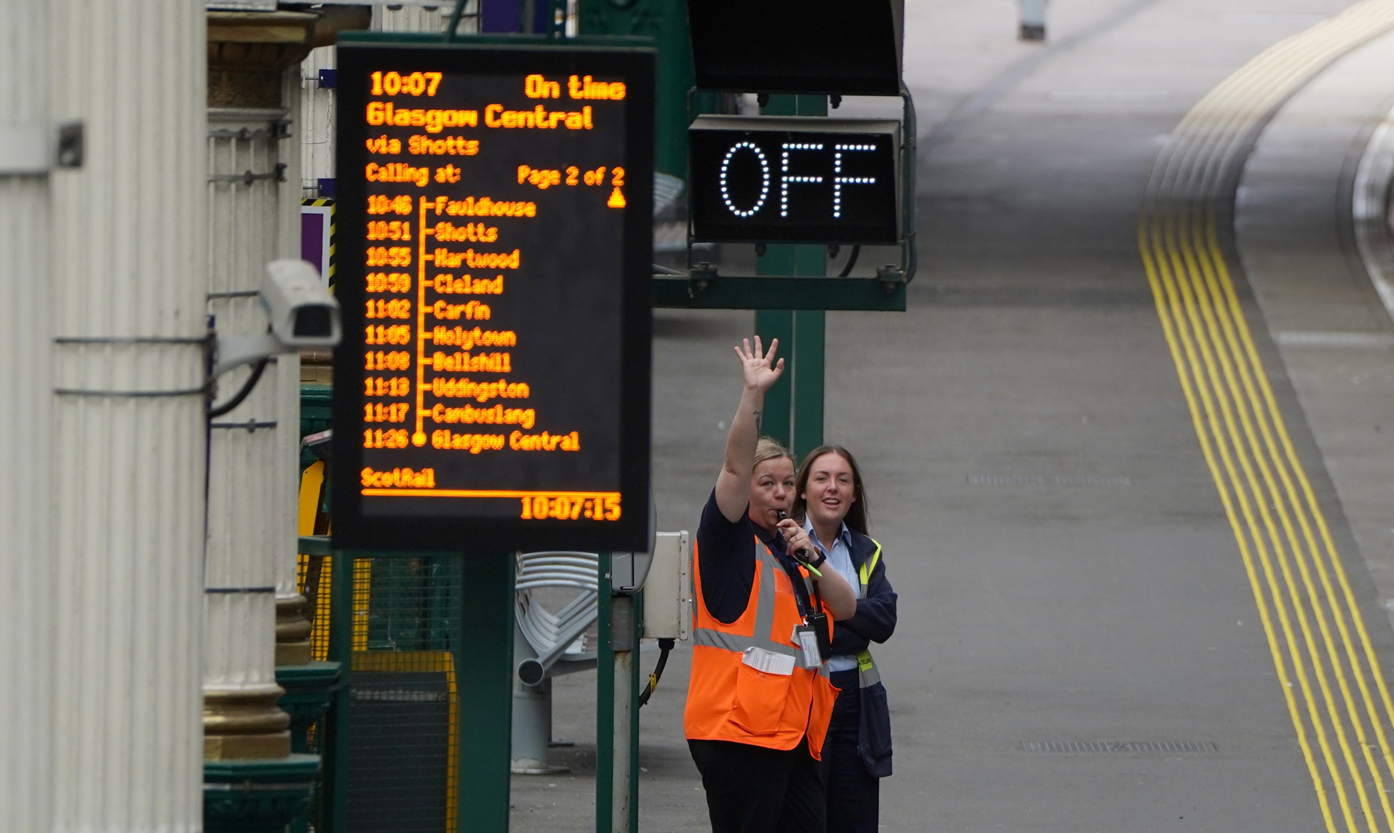 Train staff wave off a train at Waverley Station in Edinburgh, as train services continue to be disrupted following the nationwide strike. Boris Johnson called the strike a “terrible idea” (Andrew Milligan/PA)