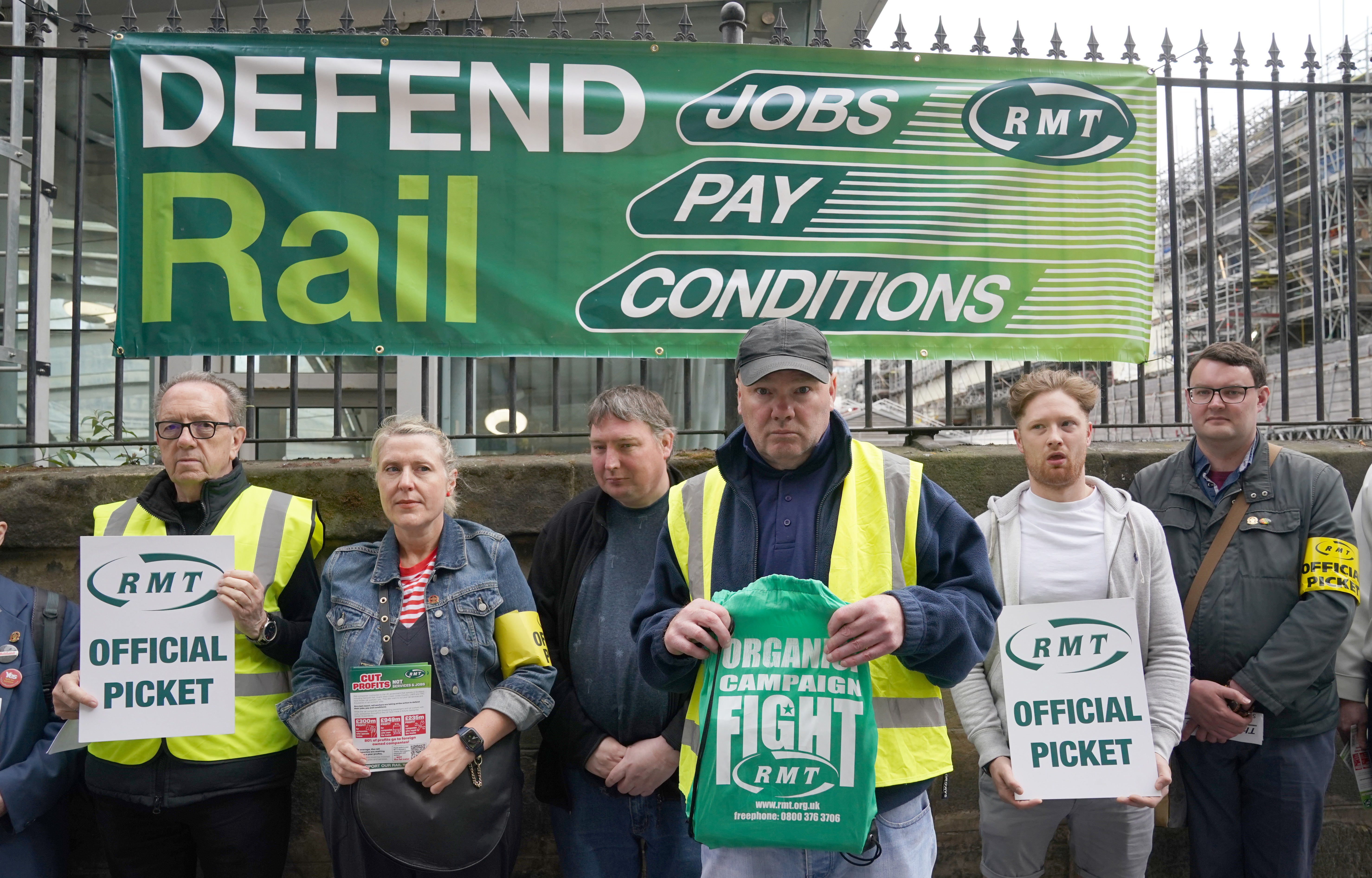 Members of the RMT picket at the entrance to Waverley Station in Edinburgh (Andrew Milligan/PA)