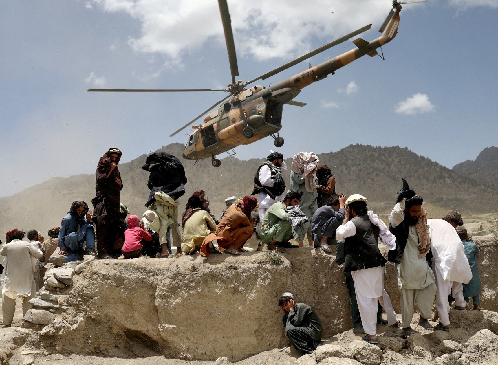 A Taliban helicopter takes off after bringing aid to the site of the earthquake in Gayan