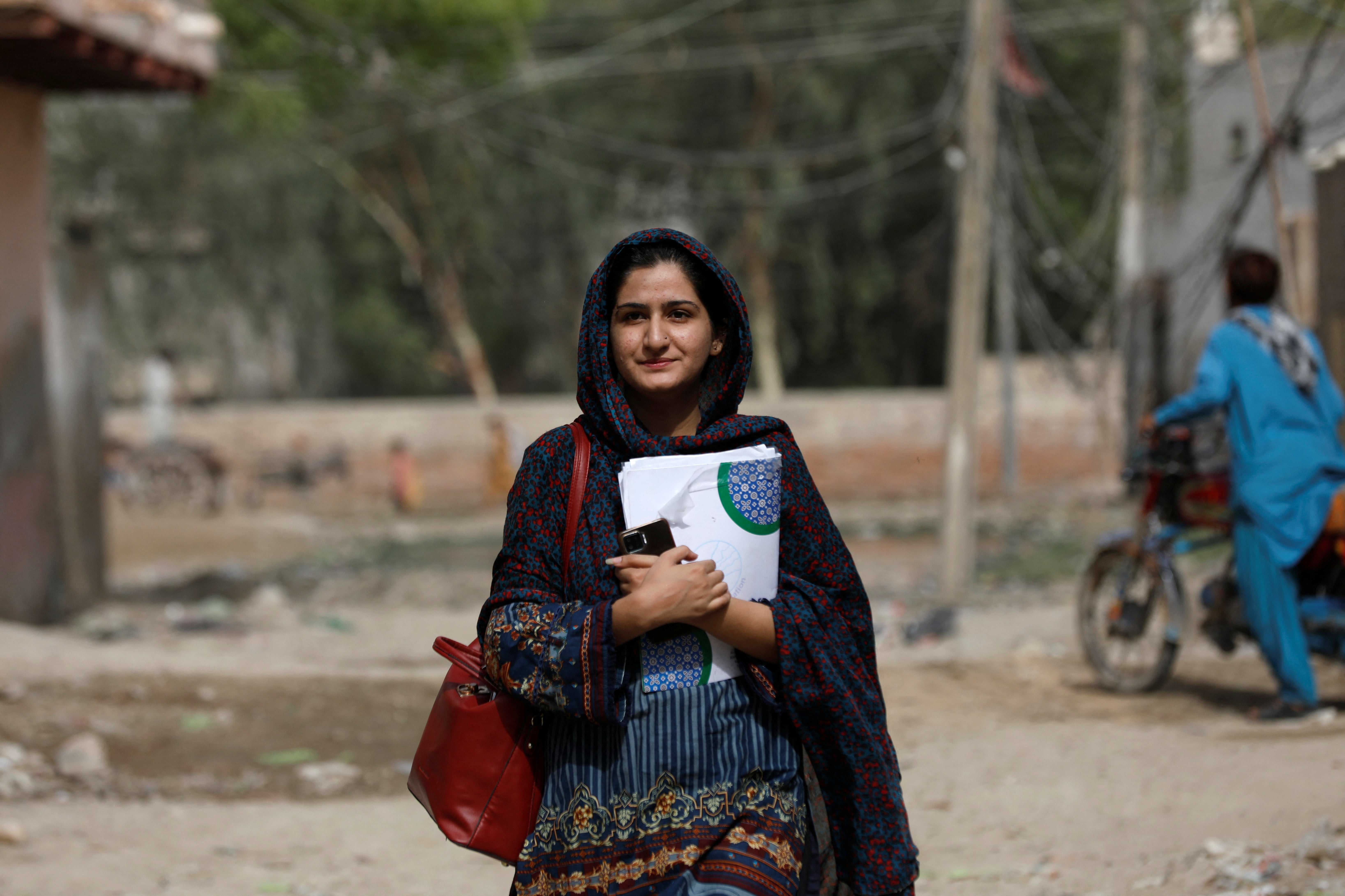 Liza Khan, project manager at the Community Development Foundation (CDF), walks to her office