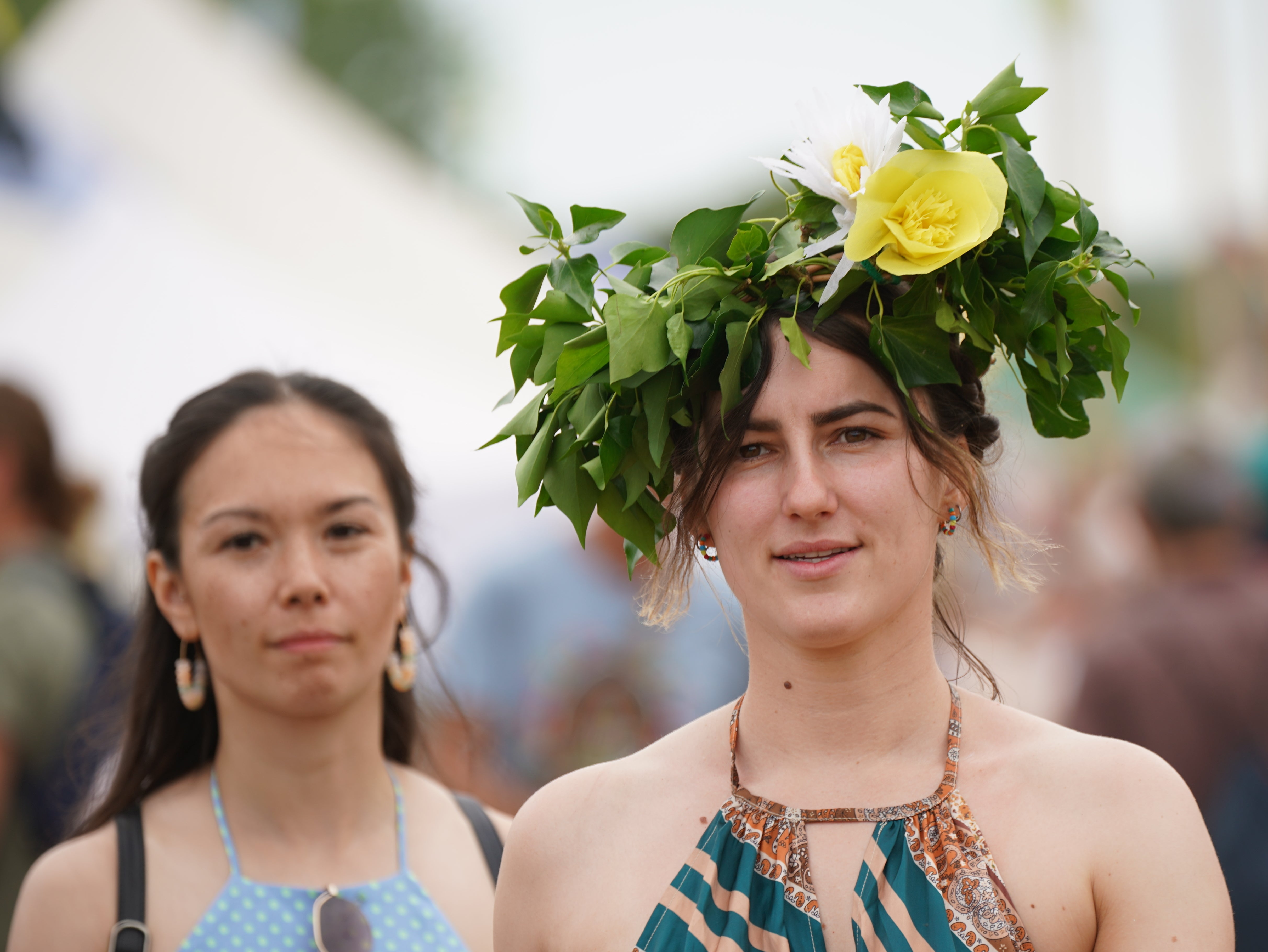 Some revellers wore fancy head-dressings to celebrate Glastonbury’s return (Yui Mok/PA)