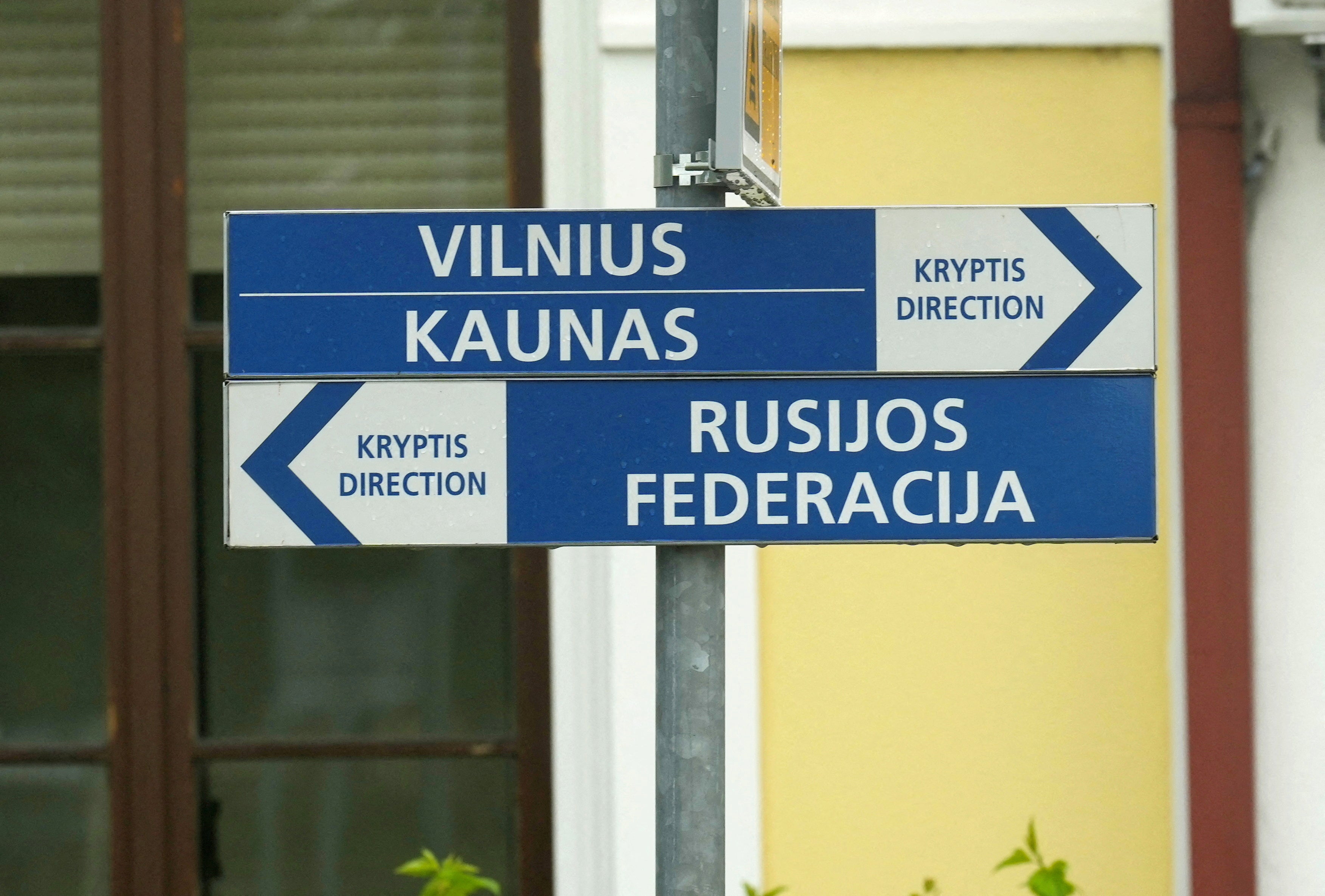 Direction signs between east and west at the border railway station in Kybartai, Lithuania