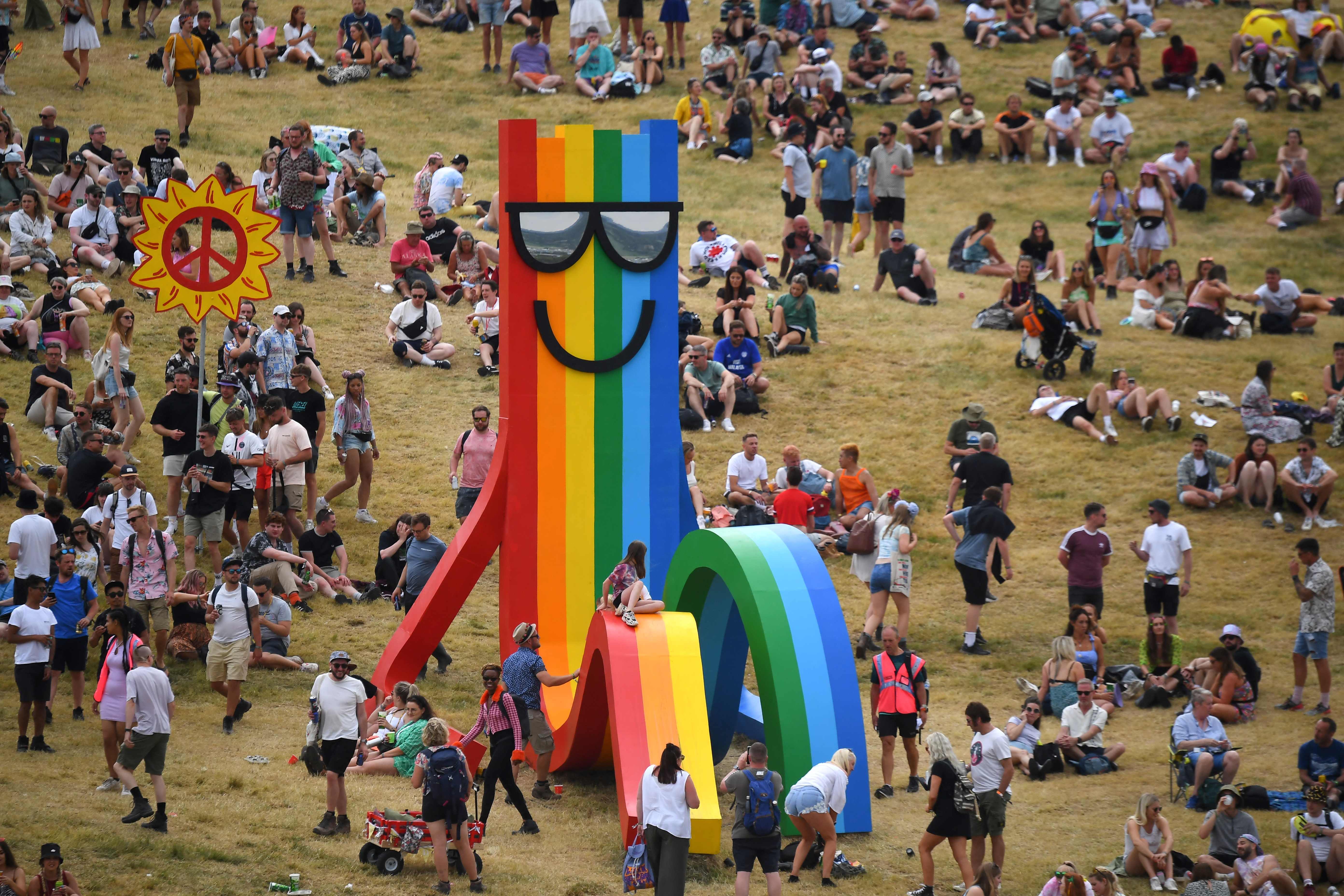 Festivalgoers mingle in a field