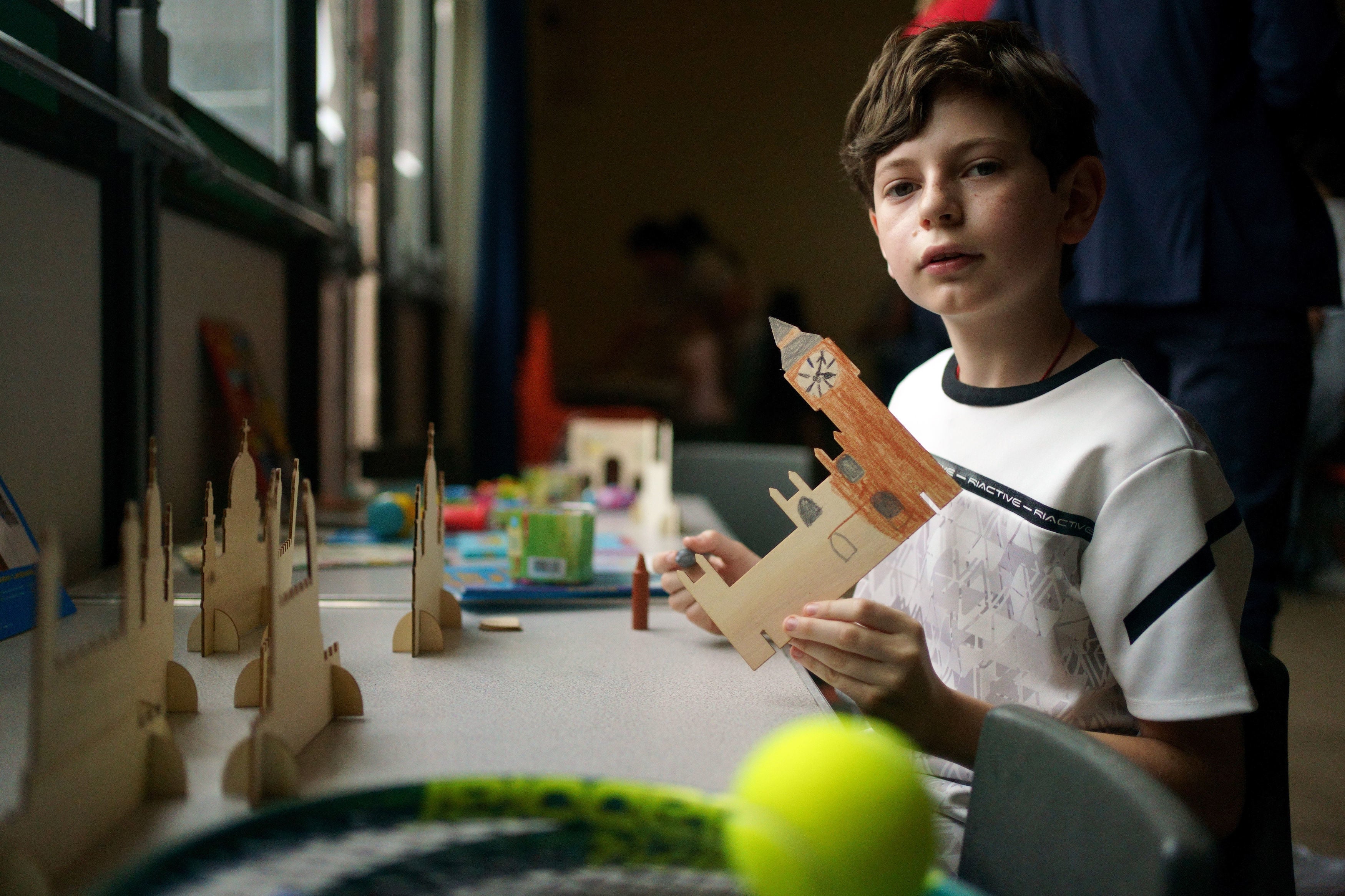 A young Ukrainian refugee at a Wimbledon themed afternoon tea (Victoria Jones/PA)