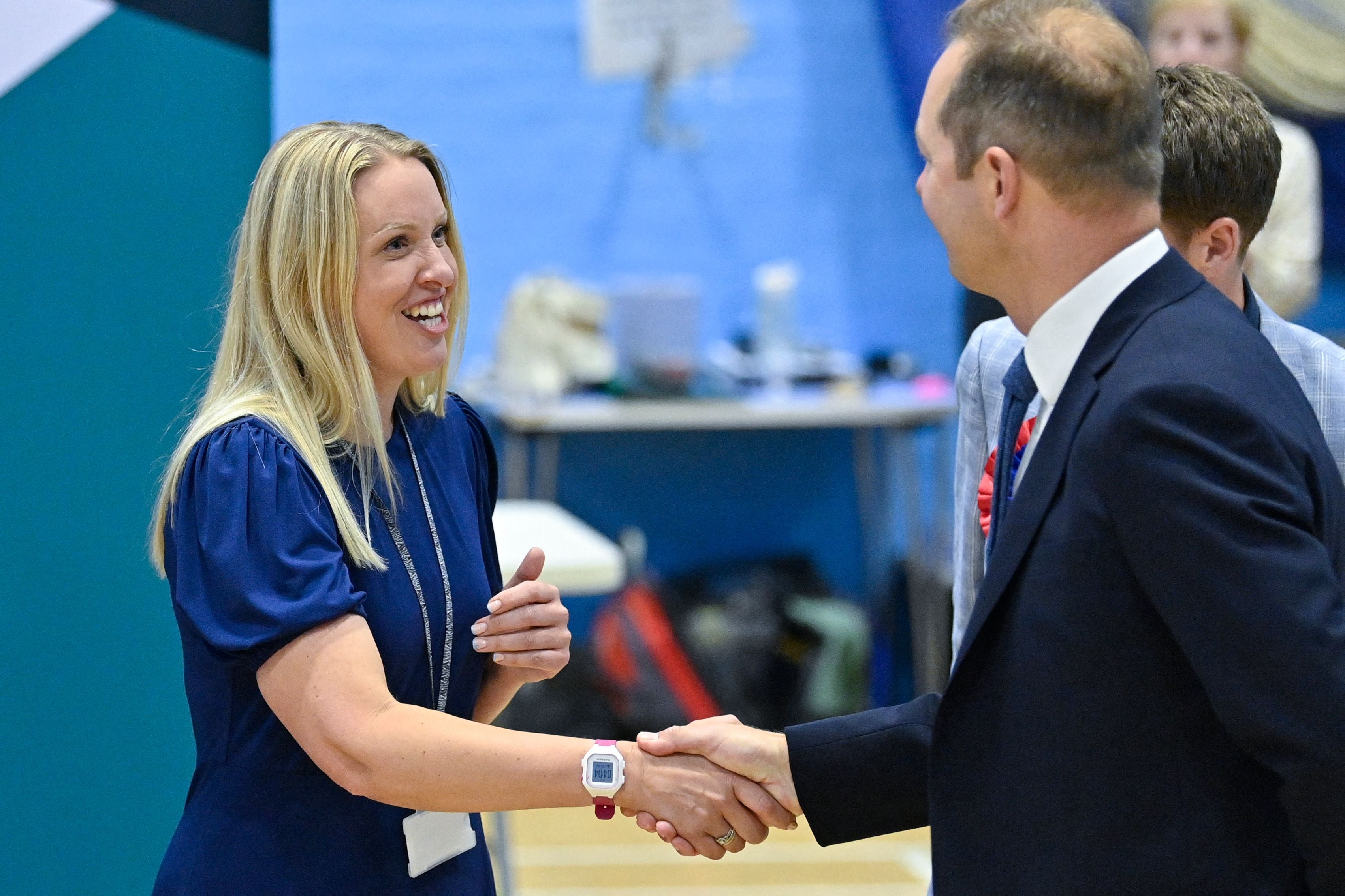 Conservative candidate Helen Hurford shakes hands with Lid Dem winner Richard Foord