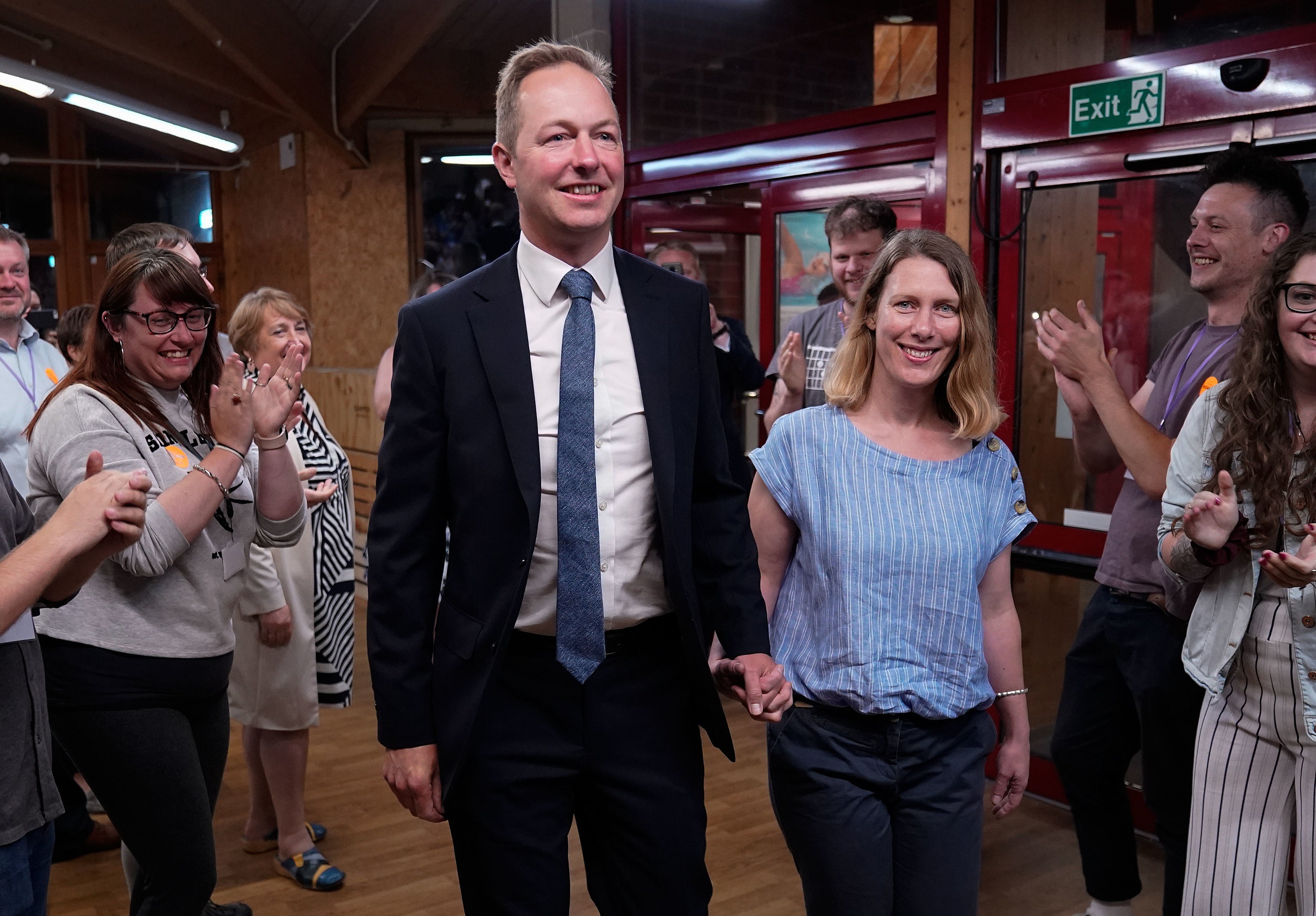 Richard Foord and his wife Kate arrive to cheers at the Tiverton by-election count