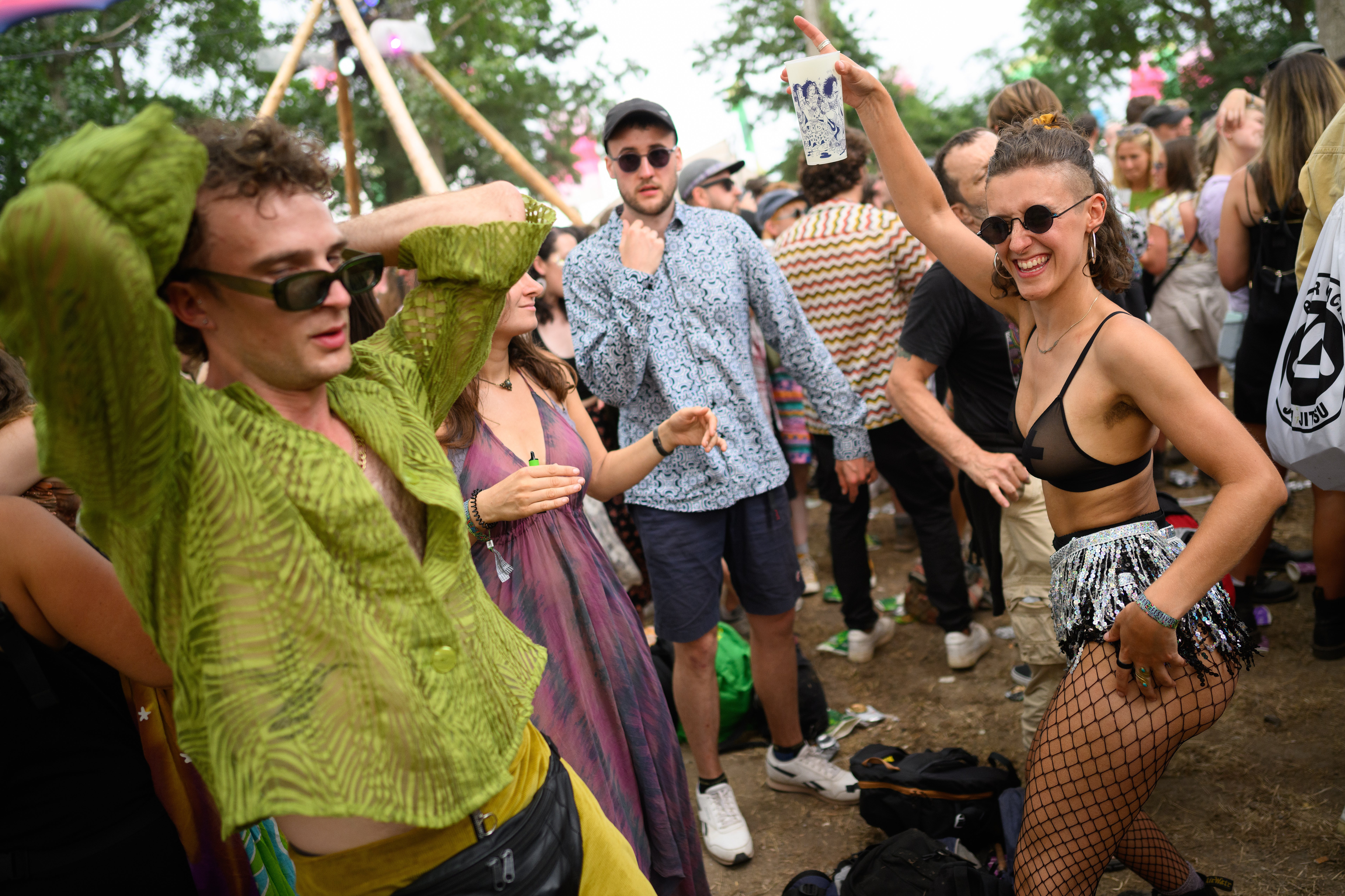 Festival-goers dance to the Hippo Sound System at the Glade Dome stage on Thursday