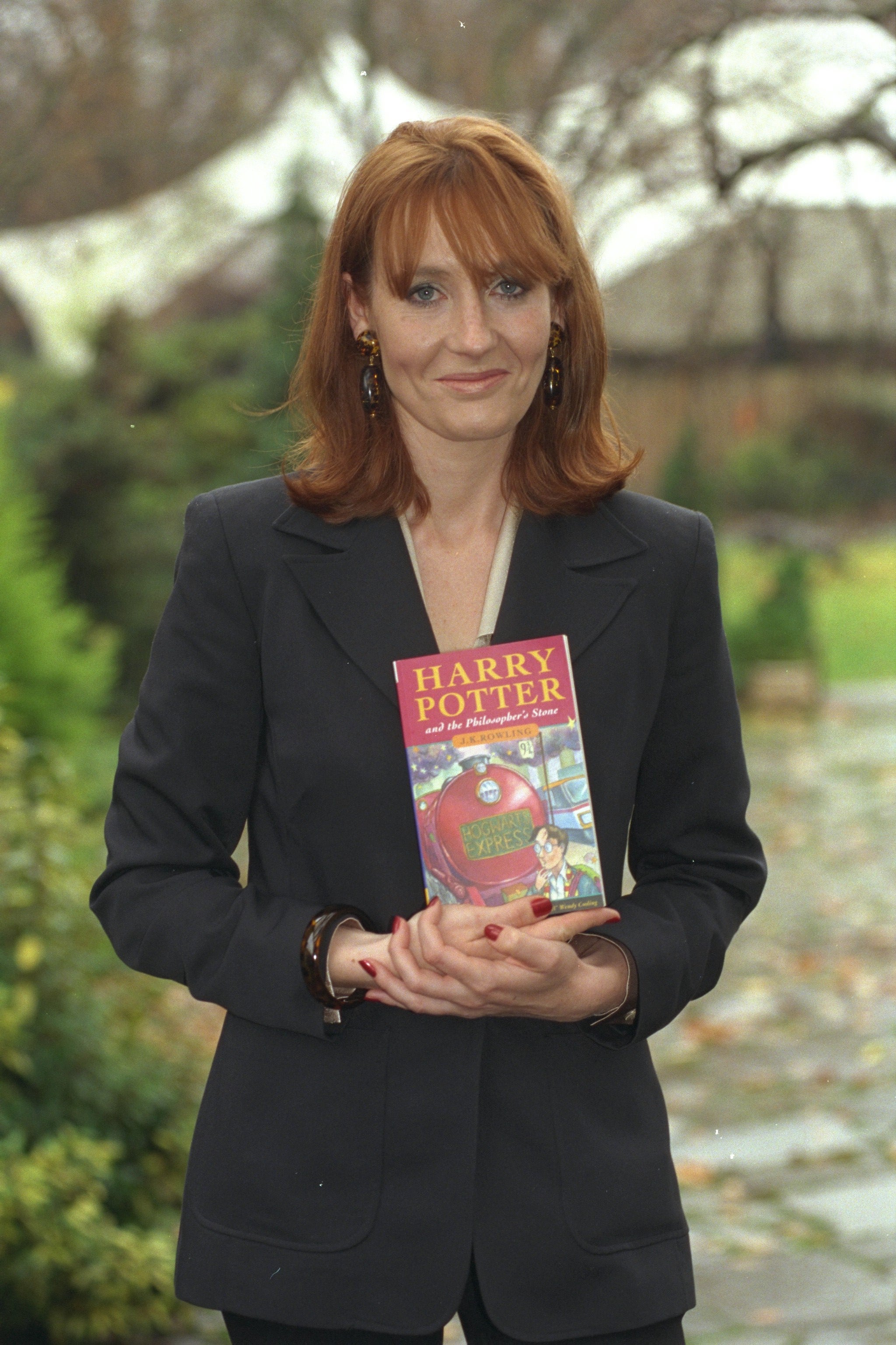 Rowling poses with her first book