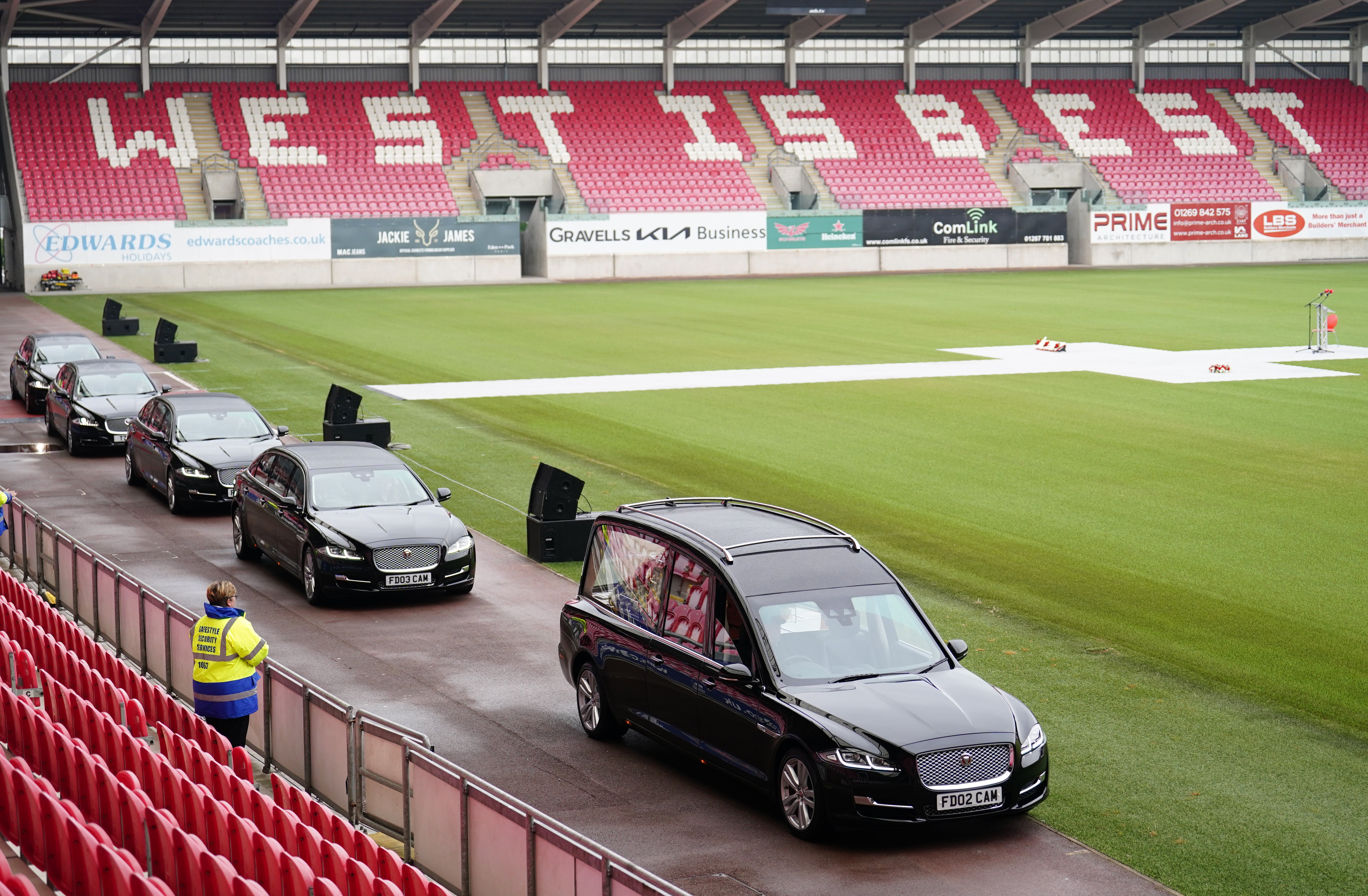 The funeral cortege leaves the stadium after the remembrance service for Phil Bennett, held at the Parc y Scarlets in Llanelli (David Davies/PA)