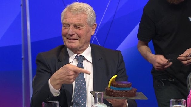 Paddy Ashdown eats a cake shaped like a hat during BBC Question Time in 2015