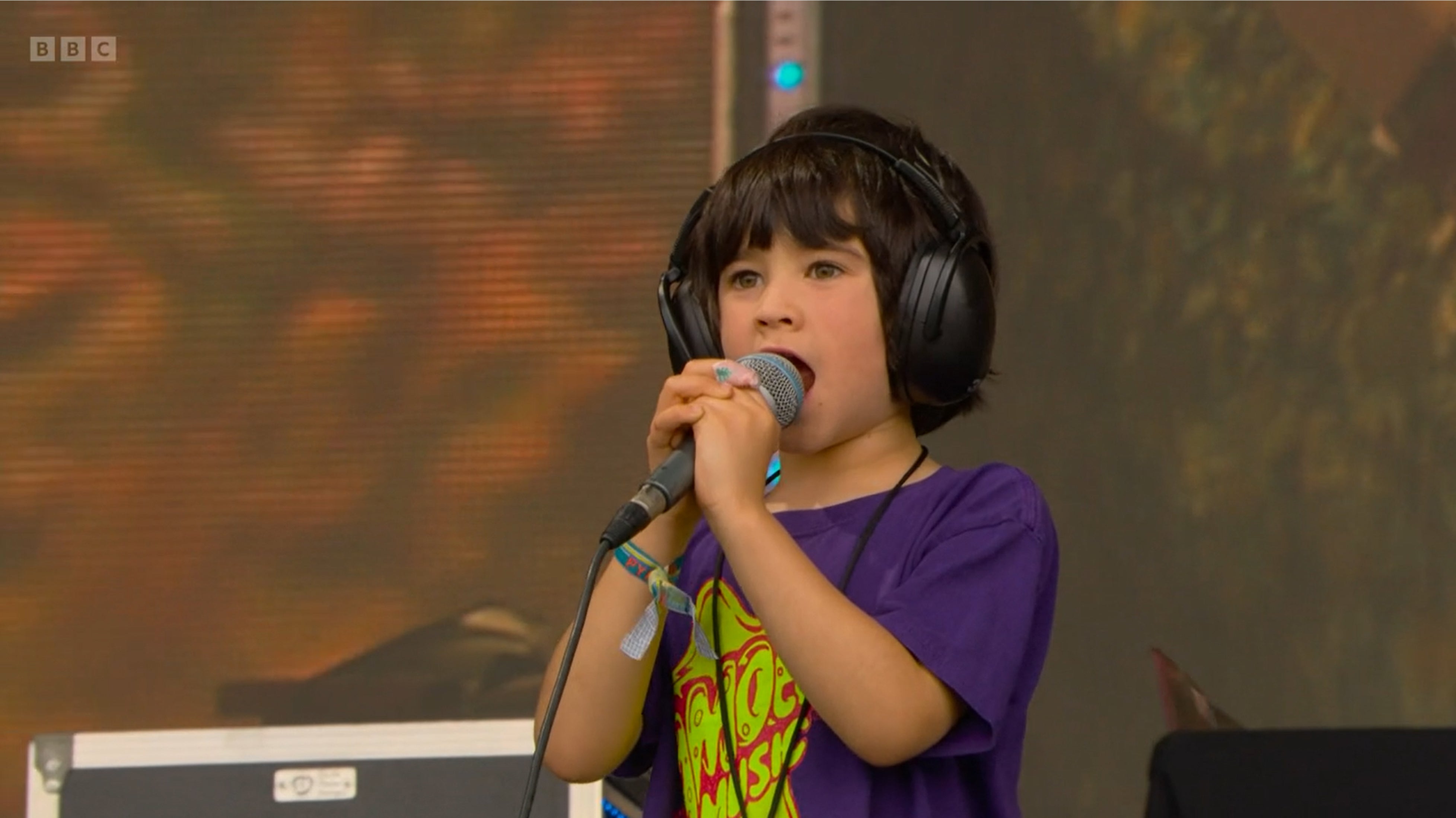 Buddy, the son of guitarist Liam Finn and grandson of frontman Neil Finn, sang along to his family’s music on the Pyramid Stage at Glastonbury (BBC/PA)