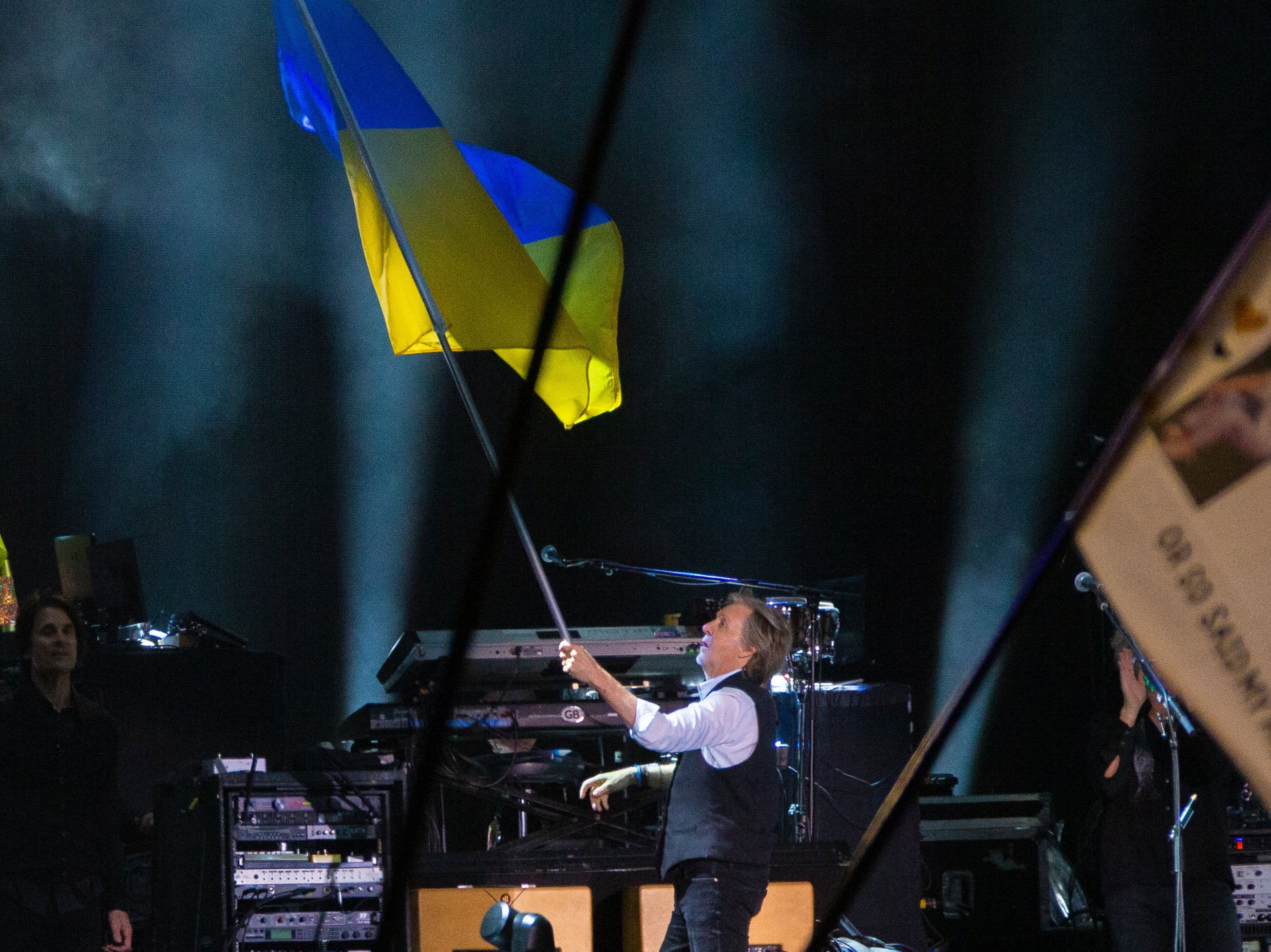 Paul McCartney waves the Ukrainian flag while performing on the Pyramid stage at Glastonbury Festival