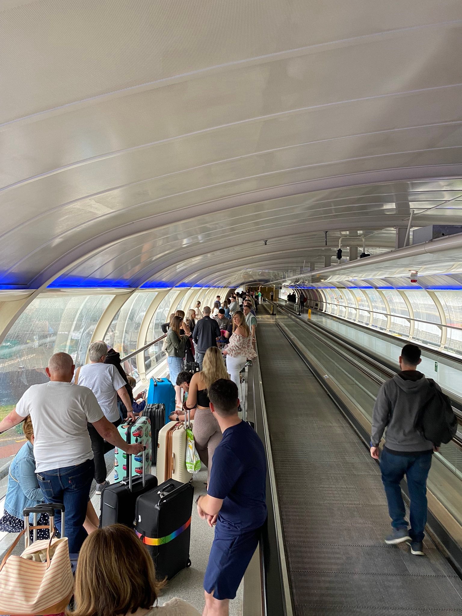 People queue at Manchester Airport, as Tui announced a “small number” of flight cancellations and delays in a blow to travel plans at the start of the half-term brea