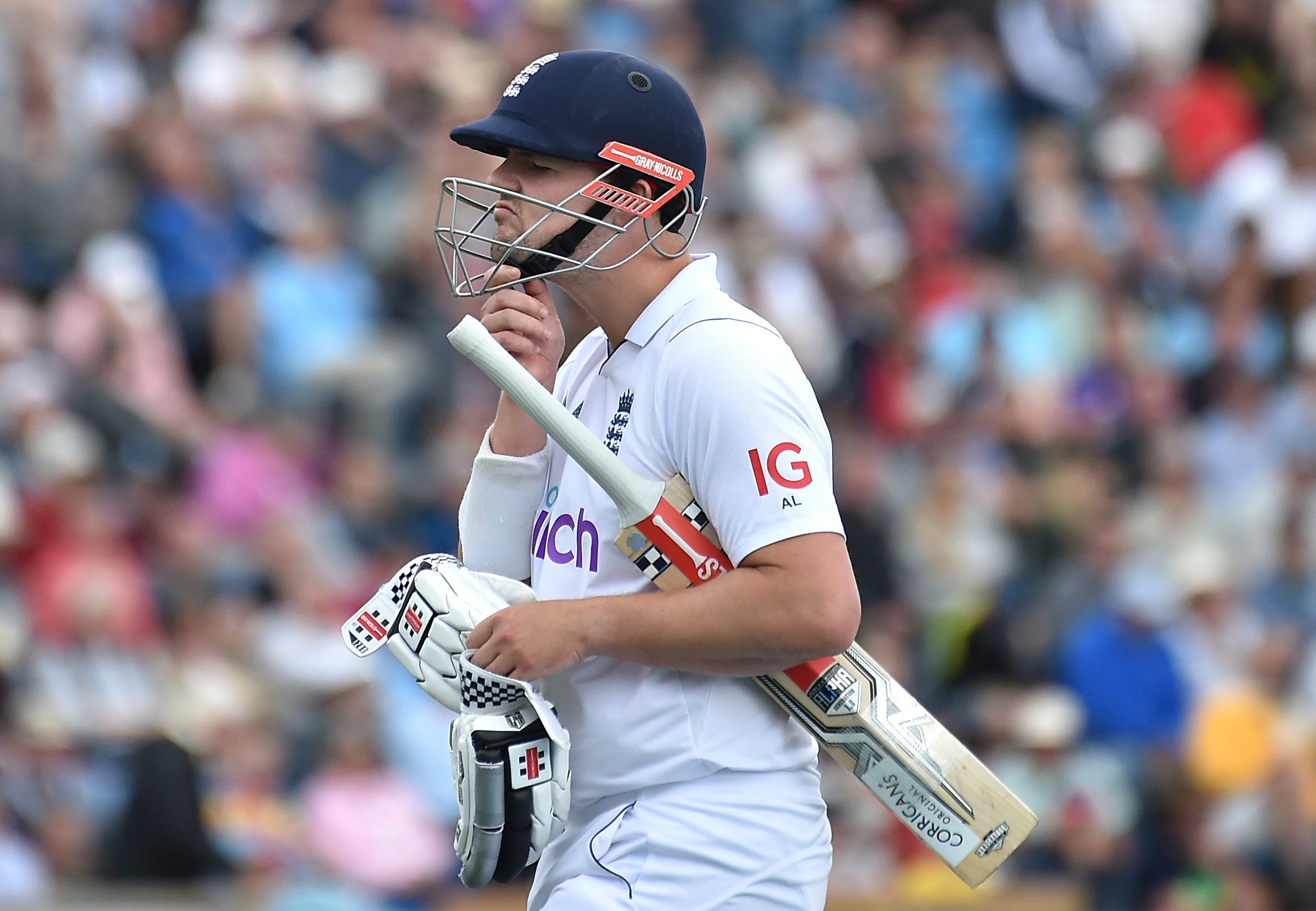 Alex Lees walks off the field after losing his wicket