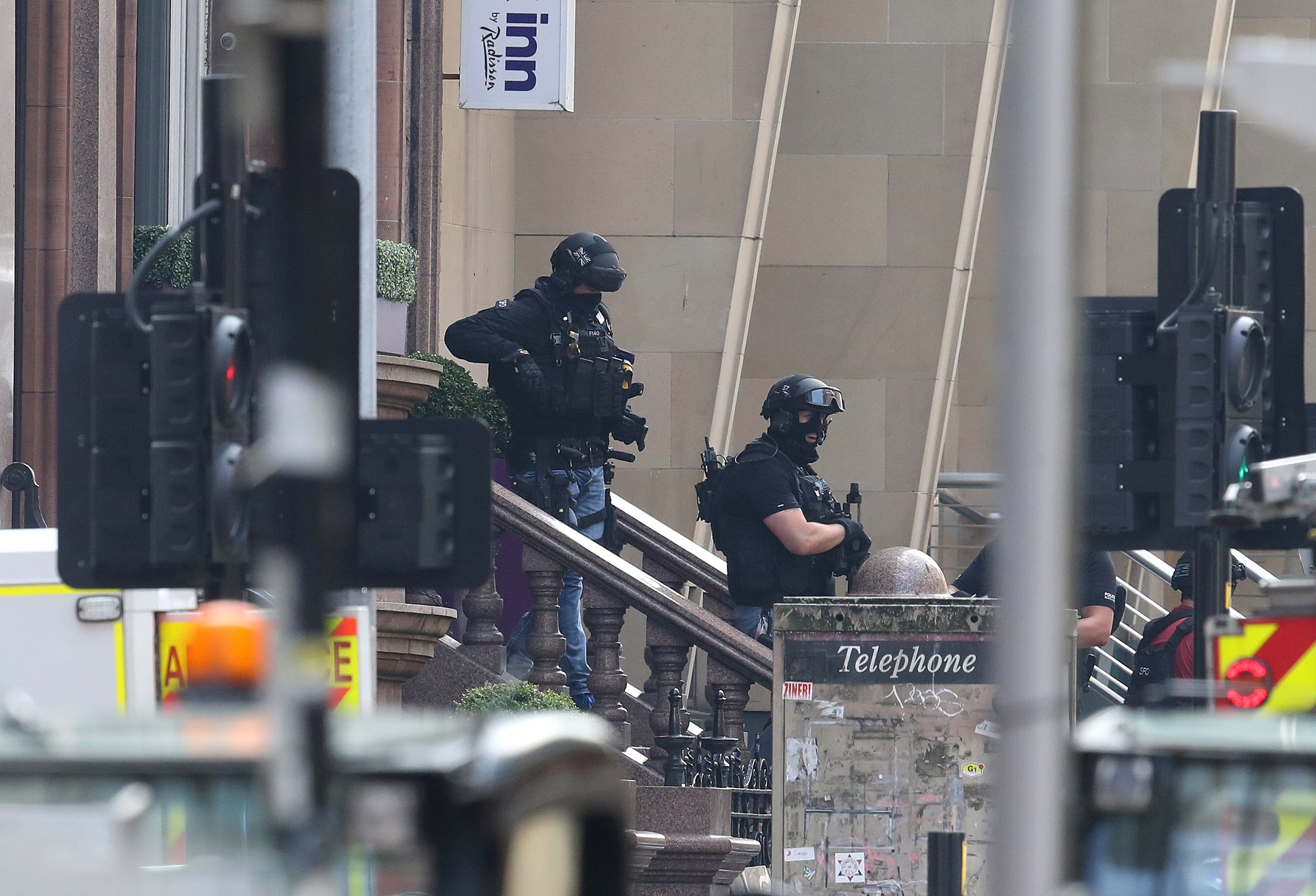 Armed police officers leave the Park Inn hotel in West George Street, Glasgow in June 2020 (Andrew Milligan/PA)