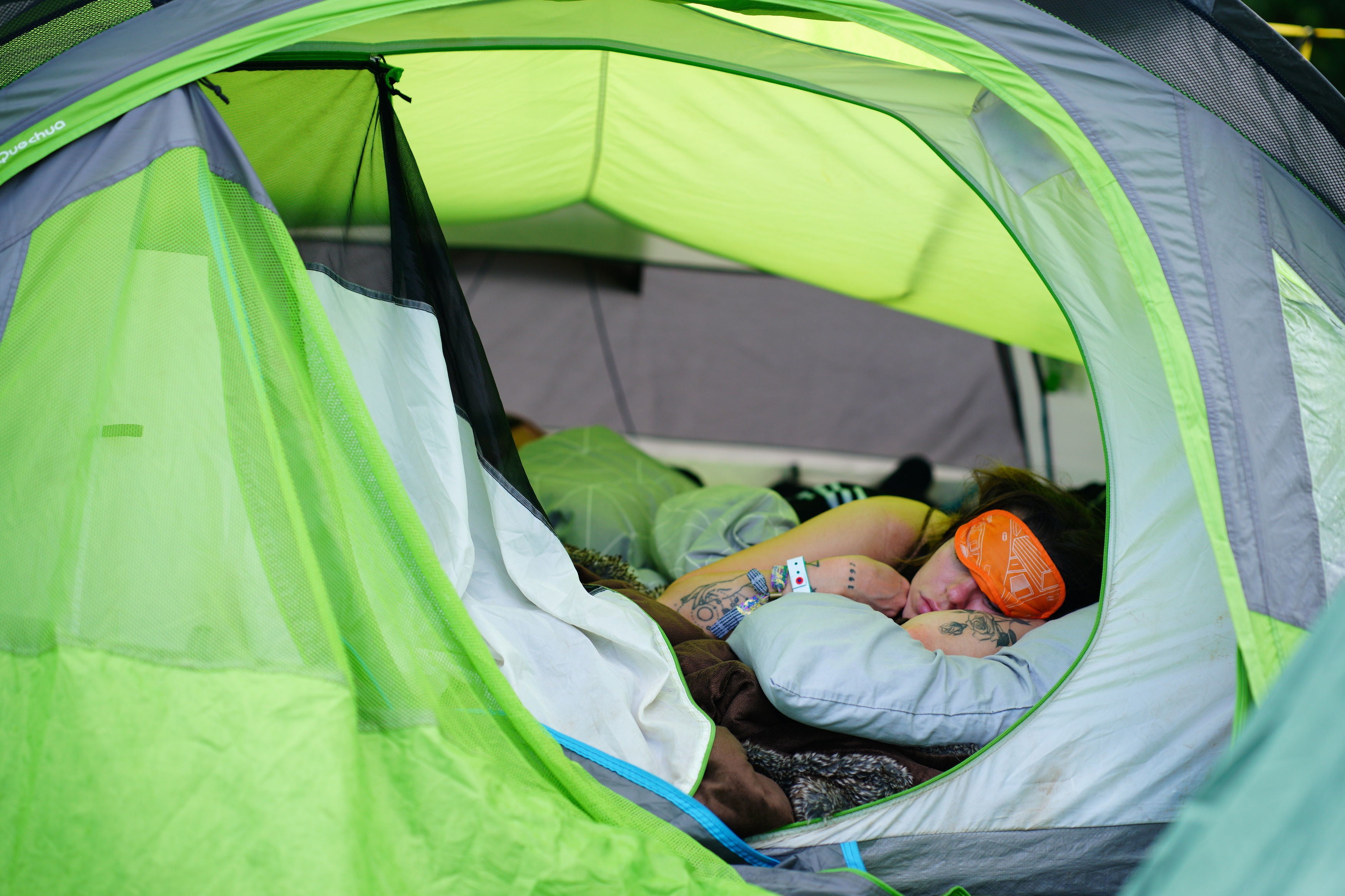 A festival goer gets some rest