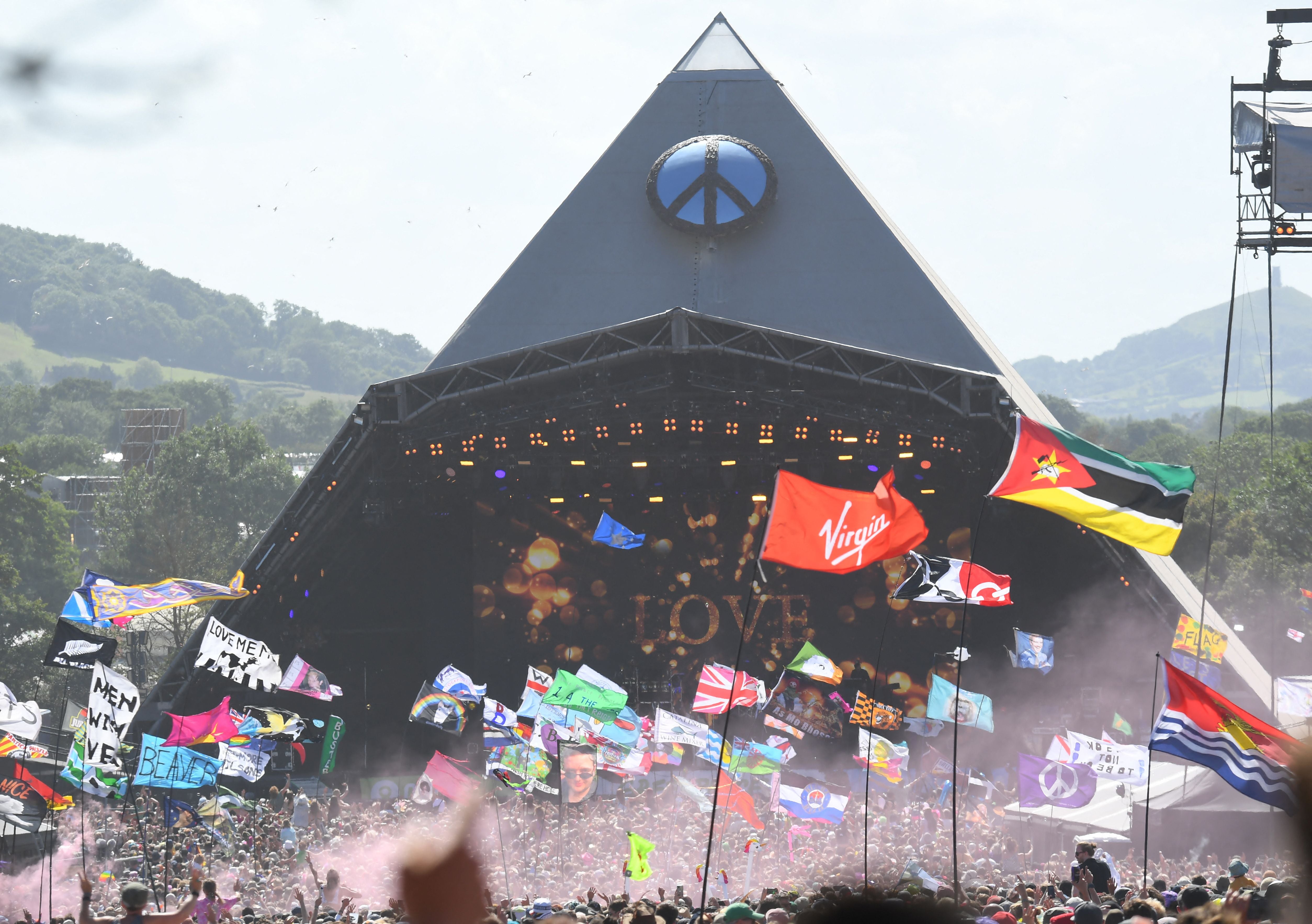 Festivalgoers watch US legend Diana Ross perform on the Pyramid Stage