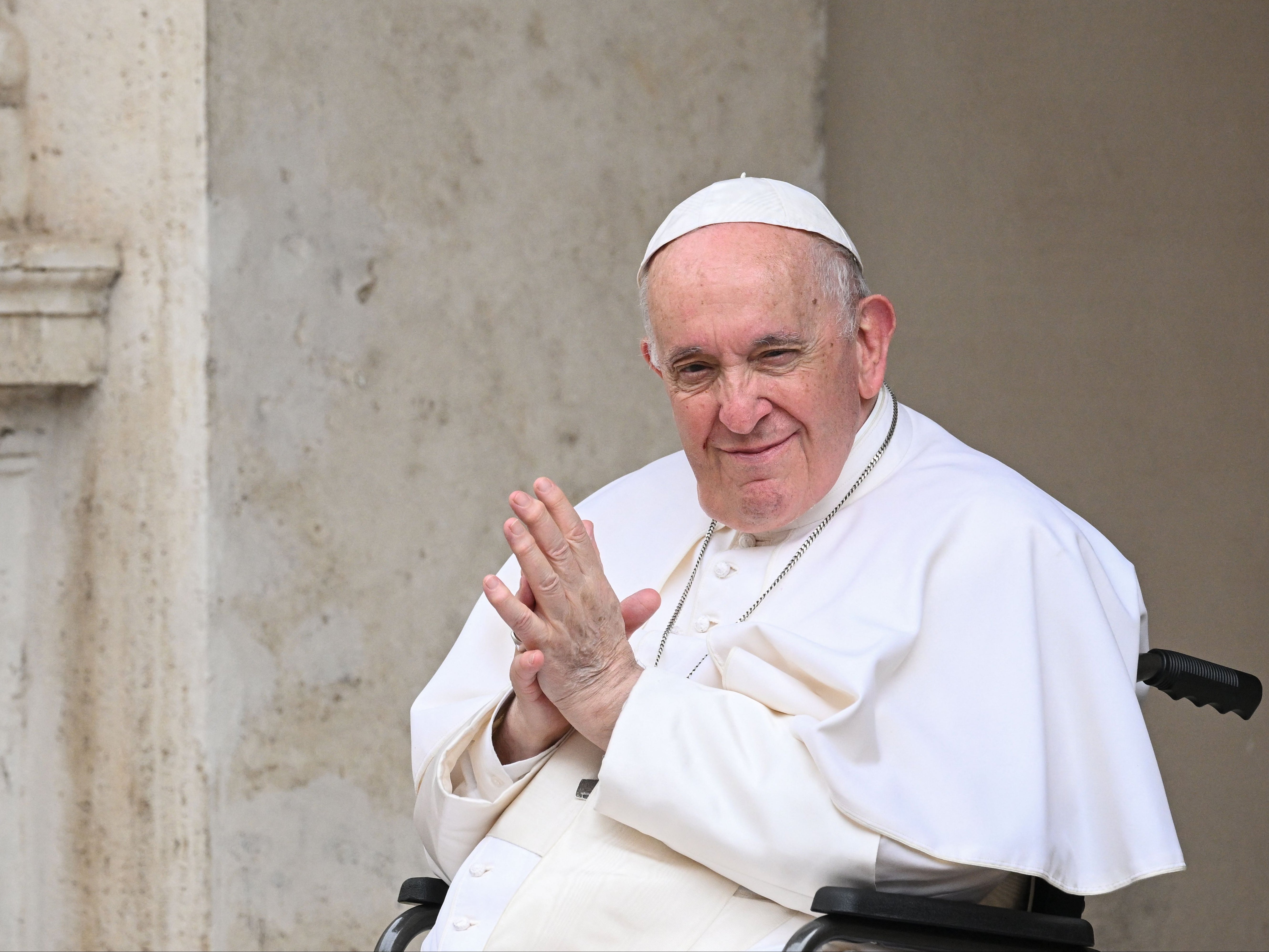 Pope Francis, seated in a wheelchair following knee treatment, presides over "The Cortile dei Bambini"