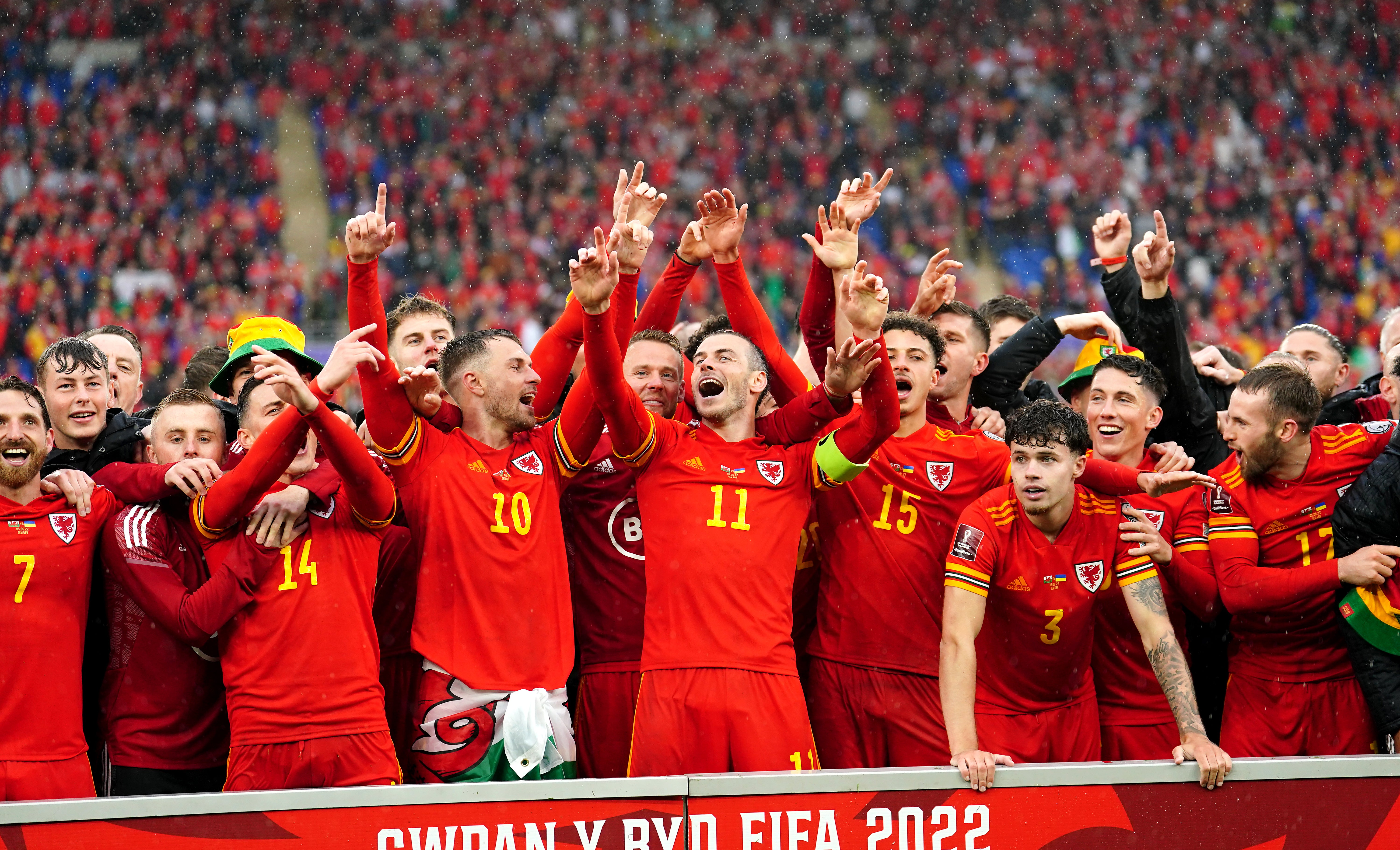 Gareth Bale (centre) celebrates after leading Wales into the 2022 World Cup (David Davies/PA)