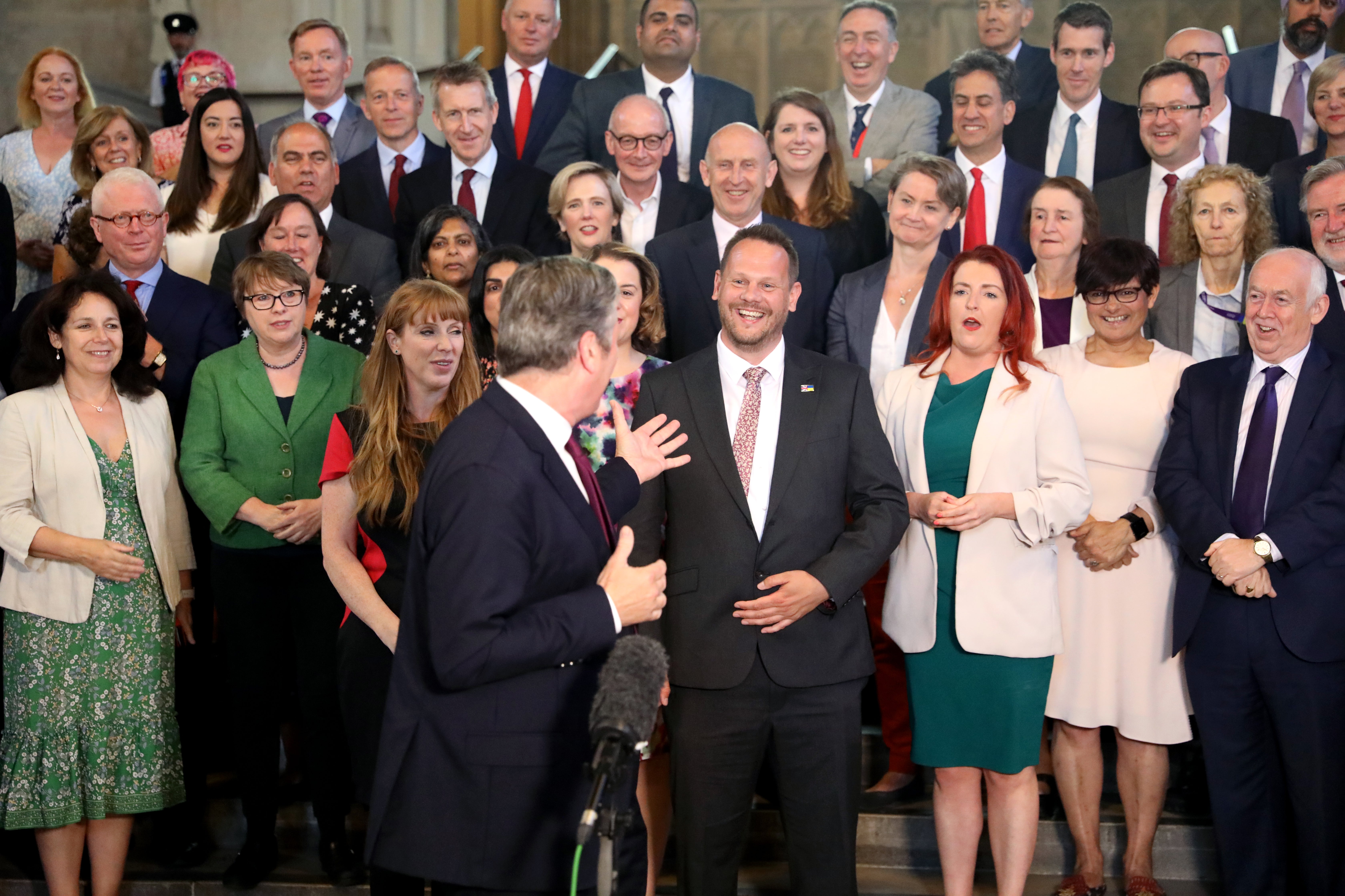 Simon Lightwood (centre) is welcomed by Labour leader Keir Starmer and the Parliamentary Labour Party (Ashlee Ruggels/PA)