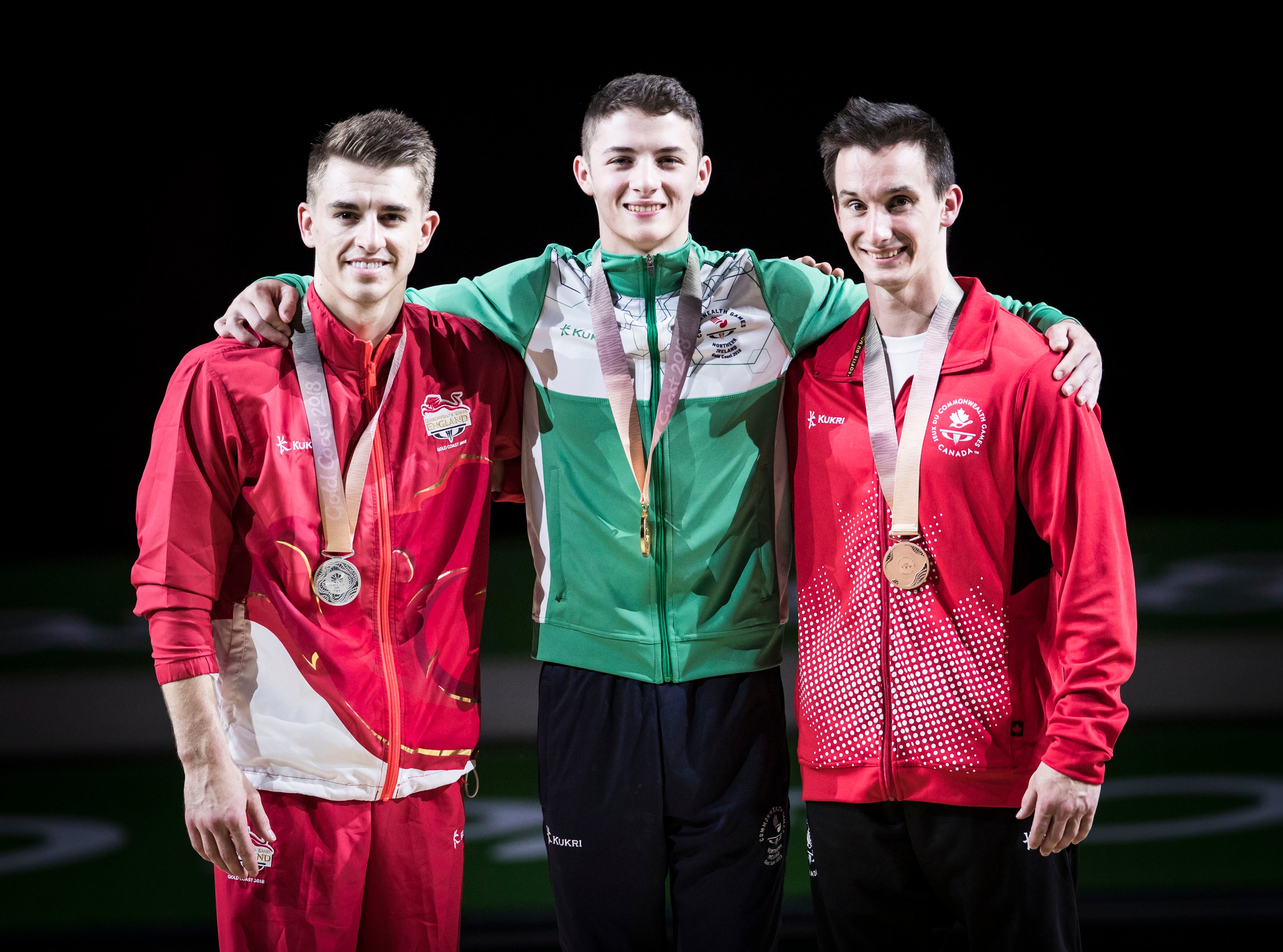 Rhys McClenaghan (centre) shocked Max Whitlock on the Gold Coast (Danny Lawson/PA)