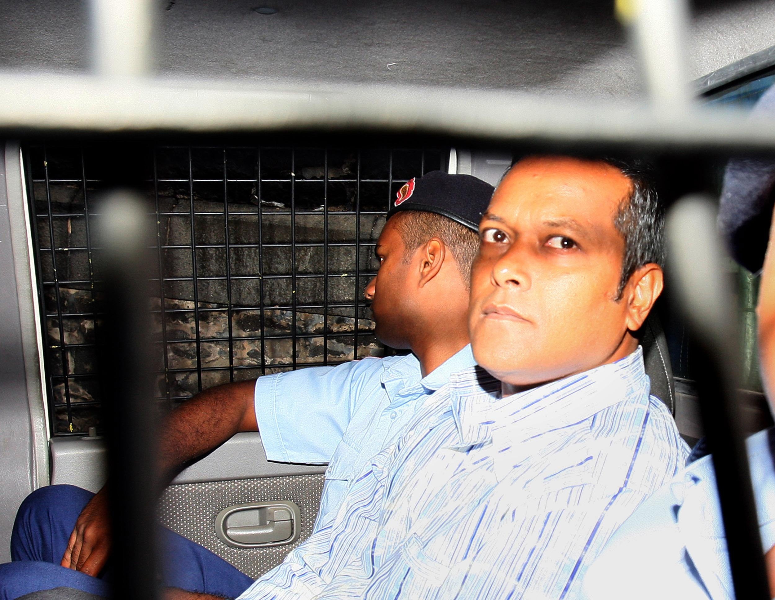 Sandip Moneea, 42 (right), arrives at the Supreme Court in Port Louis, Mauritius (PA)