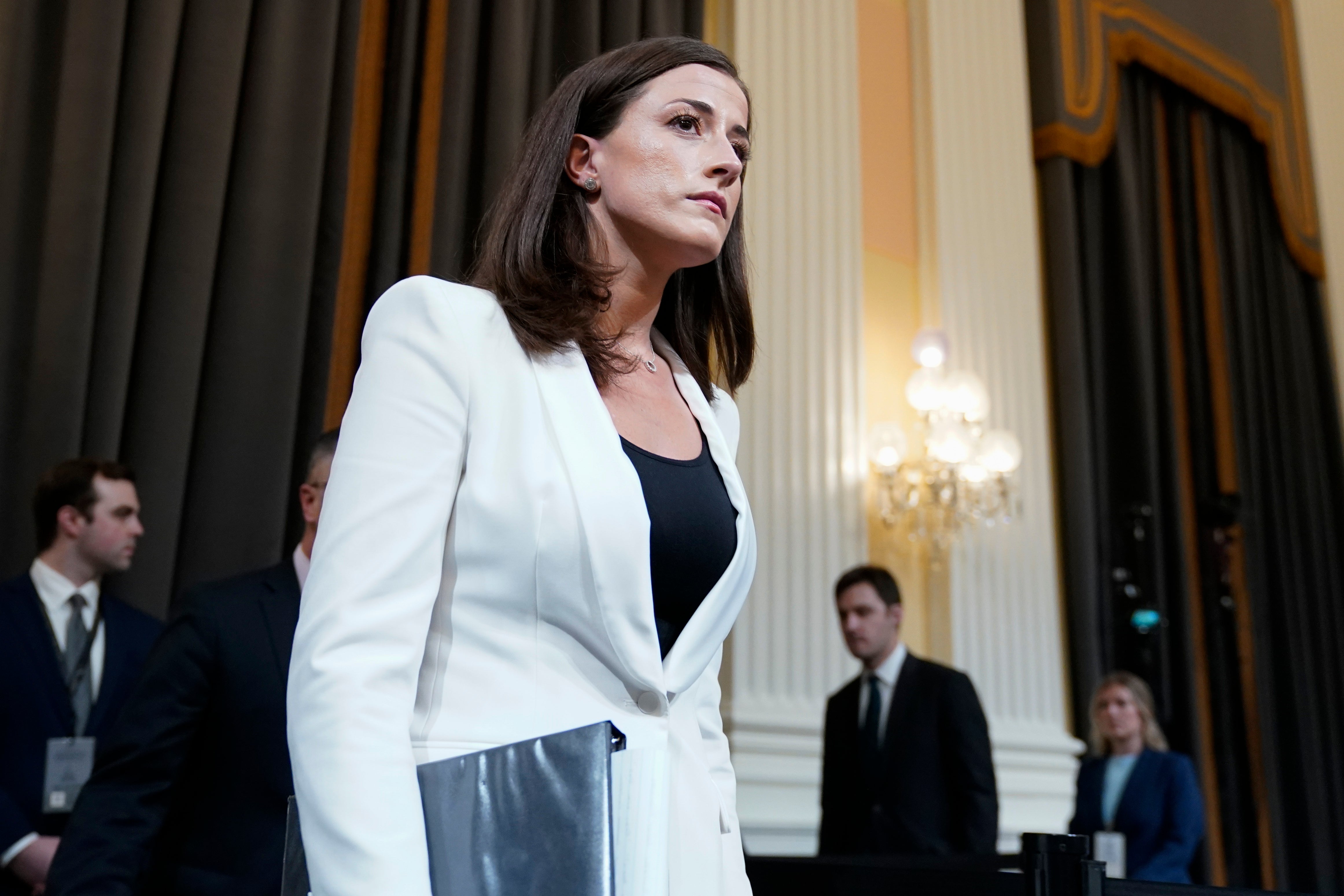 Cassidy Hutchinson, former aide to Trump White House chief of staff Mark Meadows, arrives after a break as the House select committee investigating the Jan. 6 attack on the U.S. Capitol holds a hearing at the Capitol in Washington, Tuesday, June 28, 2022