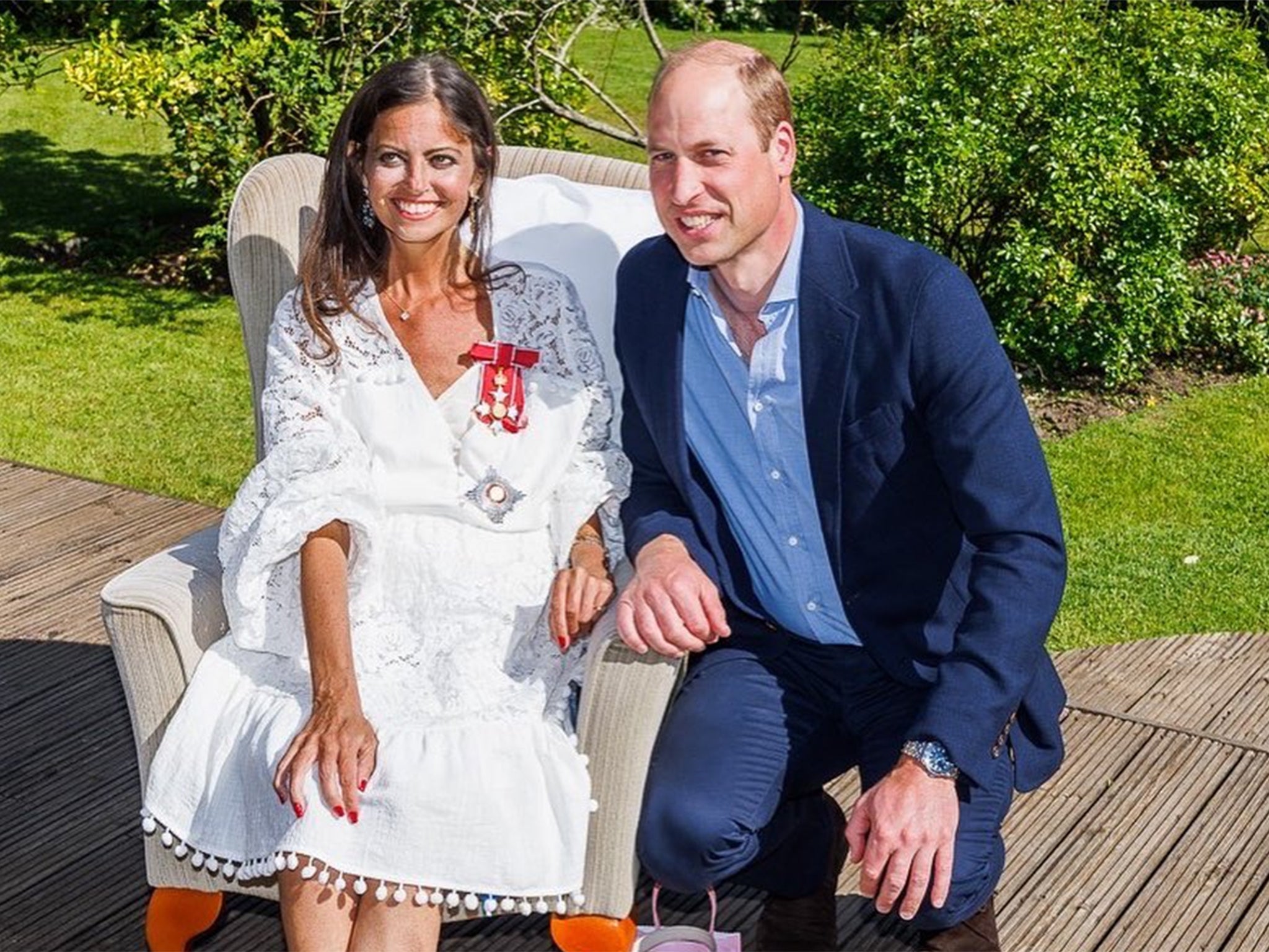 James with Prince William after he presented her with a damehood