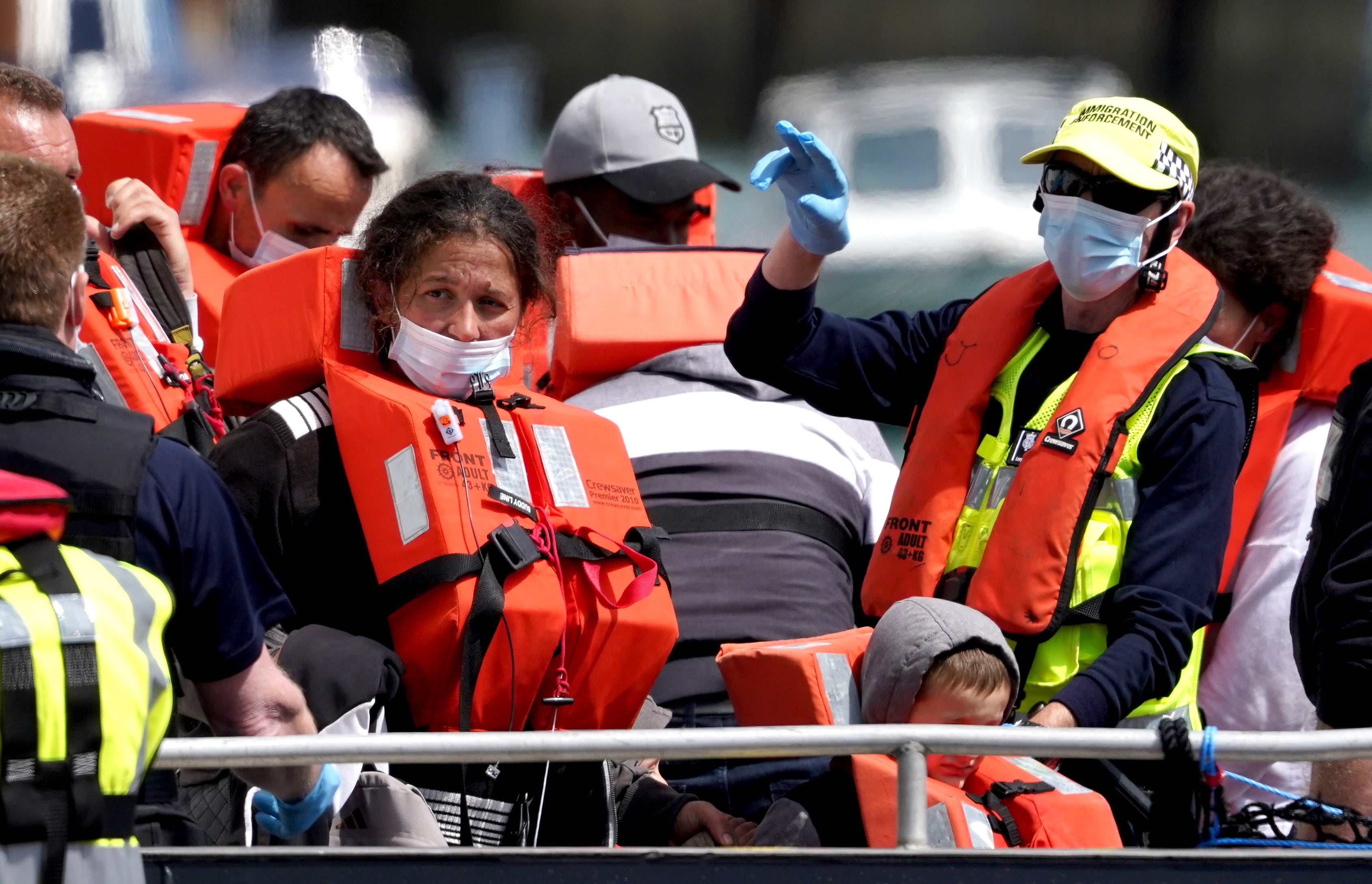 A group of people thought to be migrants are brought in to Dover, Kent, following a small boat incident in the Channel (Gareth Fuller/PA Wire)