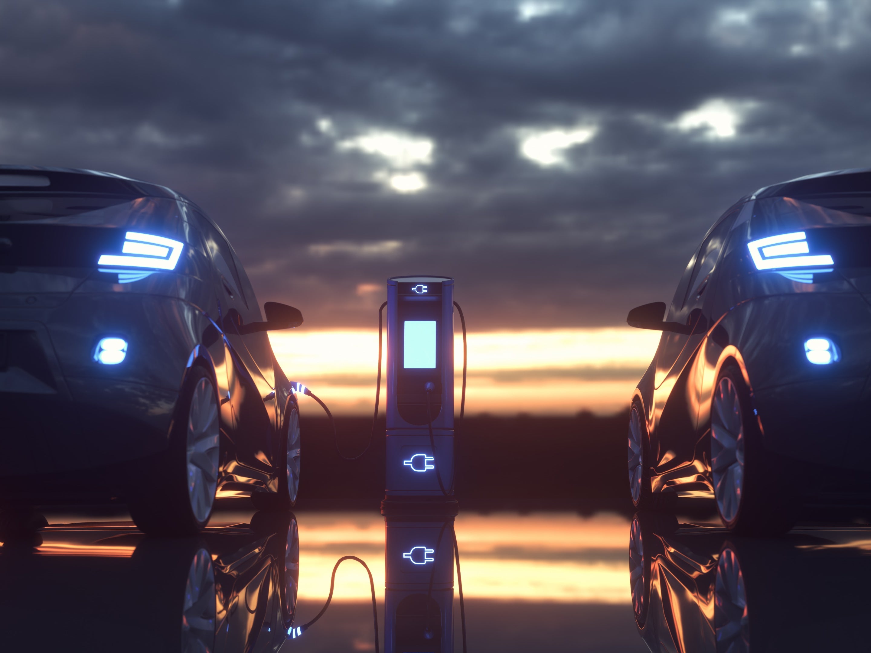 Electric cars plugged in at a charging station