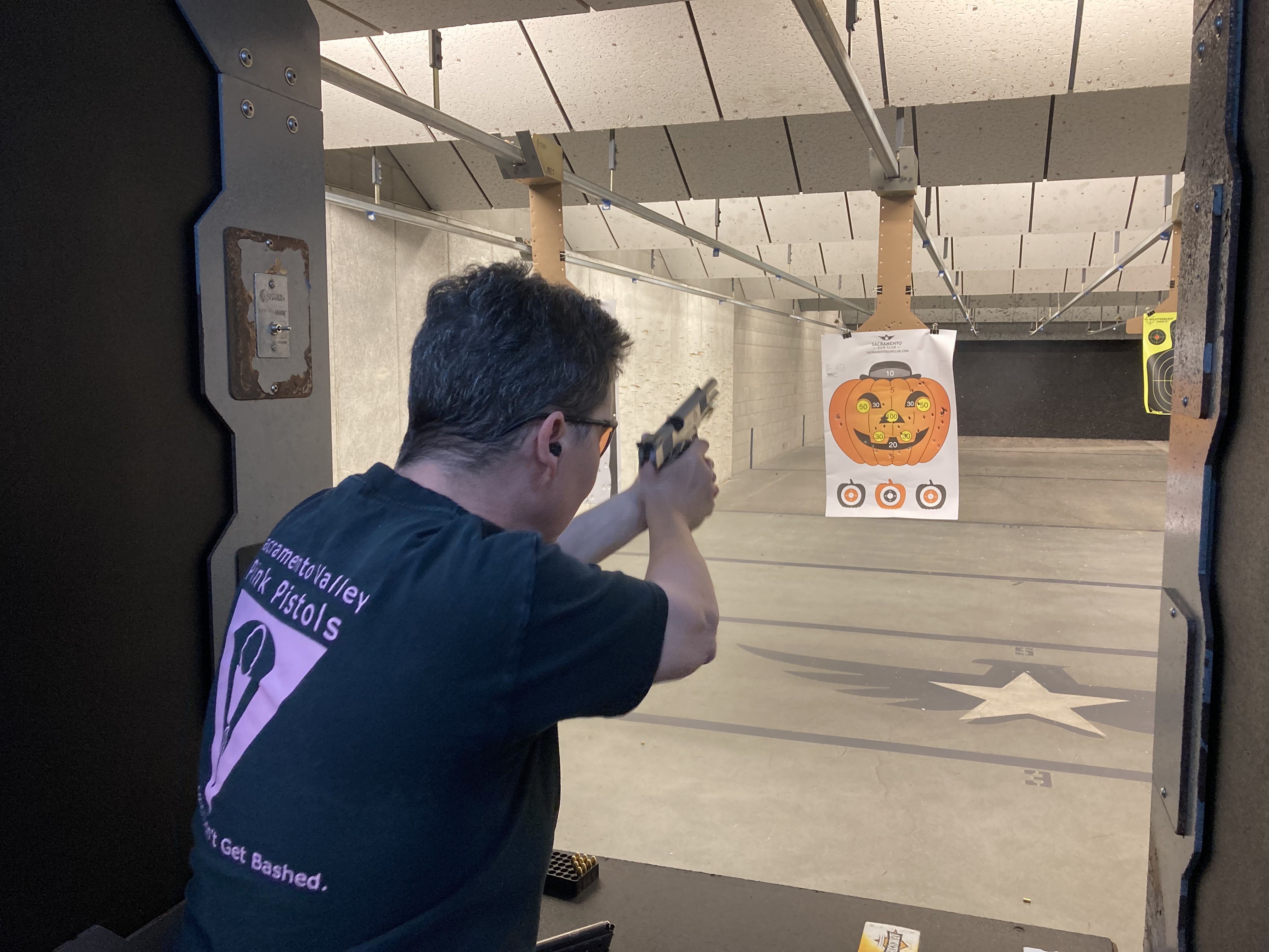 Deanna Sykes, head of the Sacramento chapter of the Pink Pistols gun group, at a shooting meet-up in May 2022