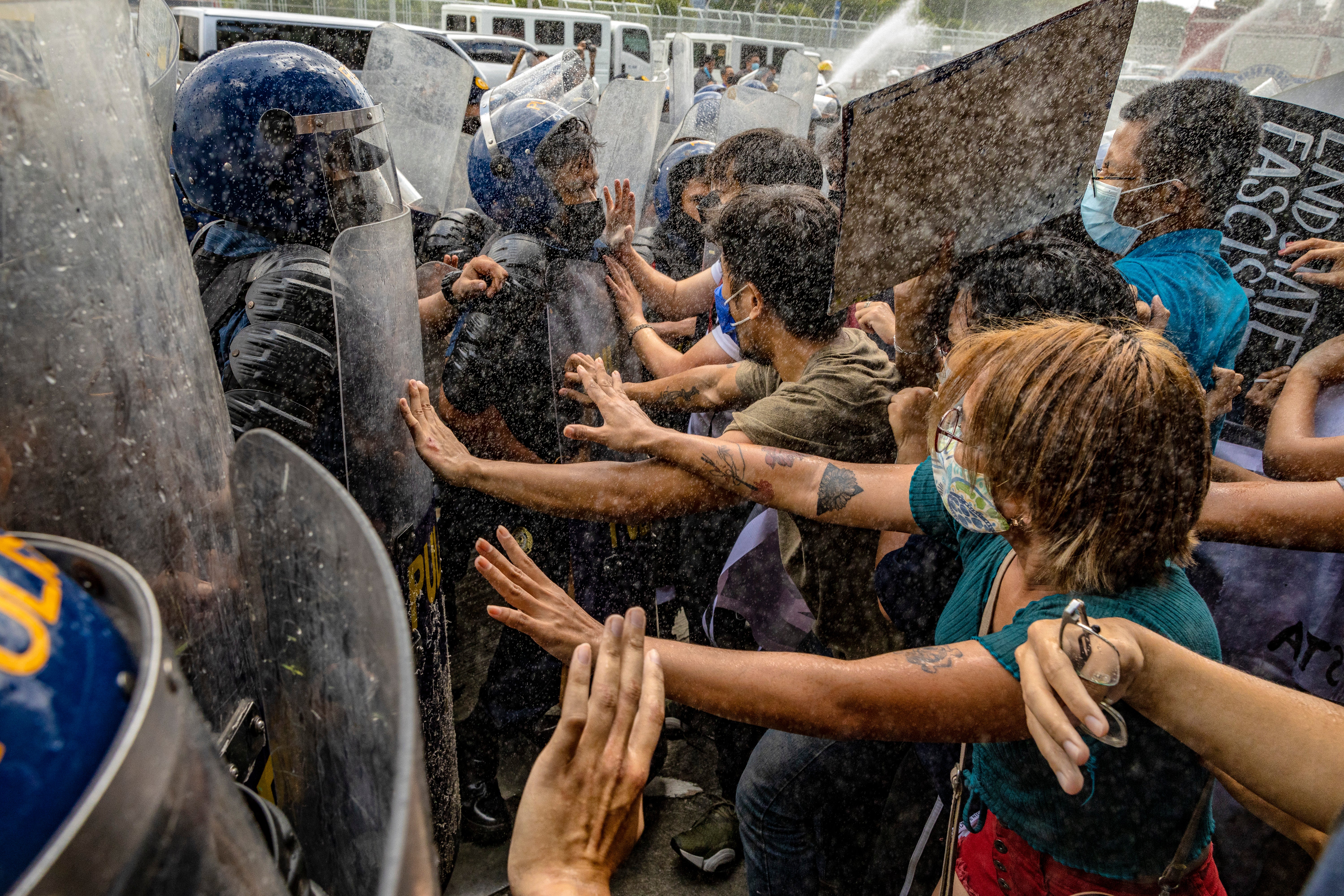 Anti-Marcos activists faced riot police and water cannons during their protest on 25 May