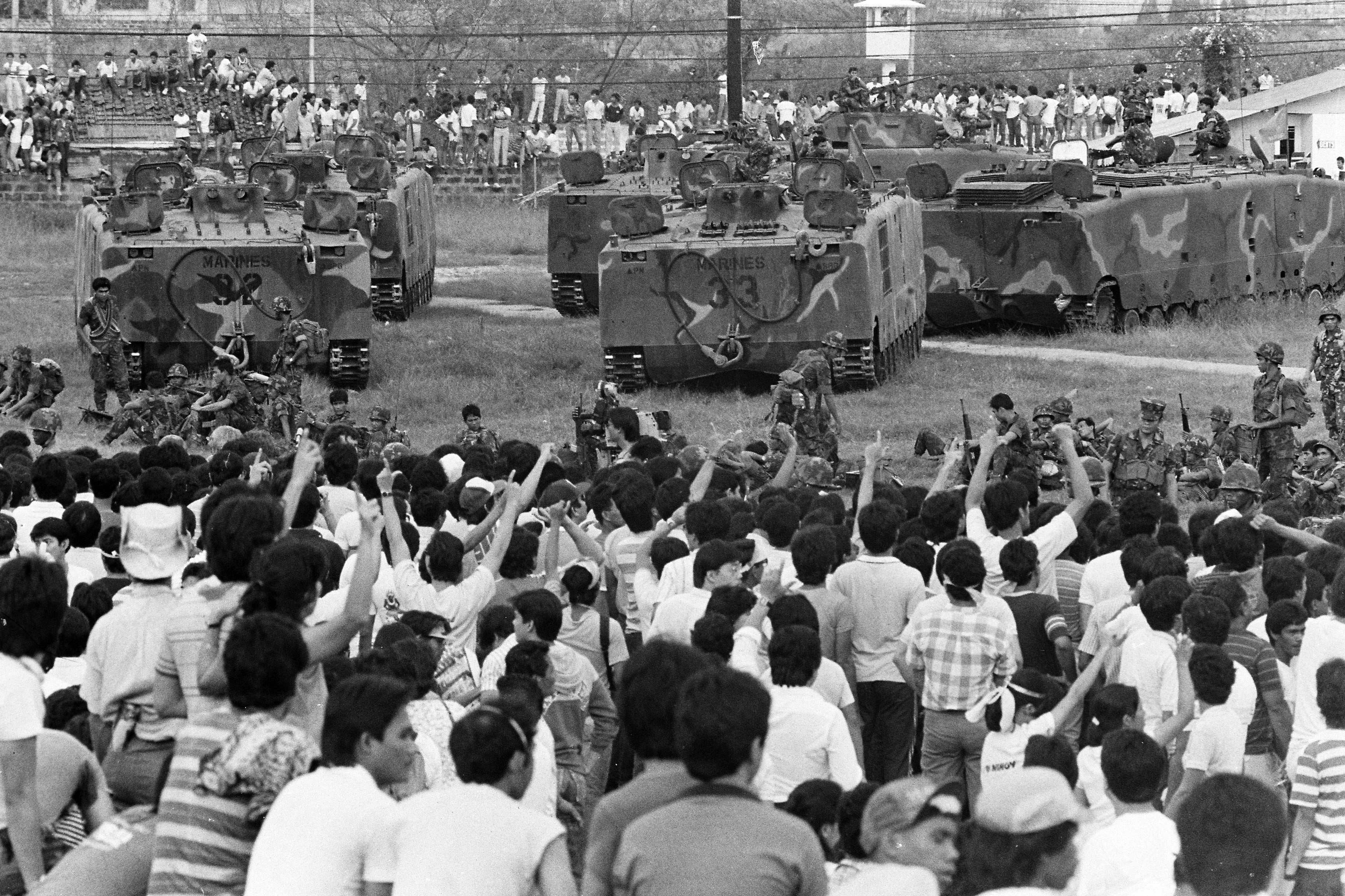 People gather at Camp Crame in Manila on 25 February, 1986