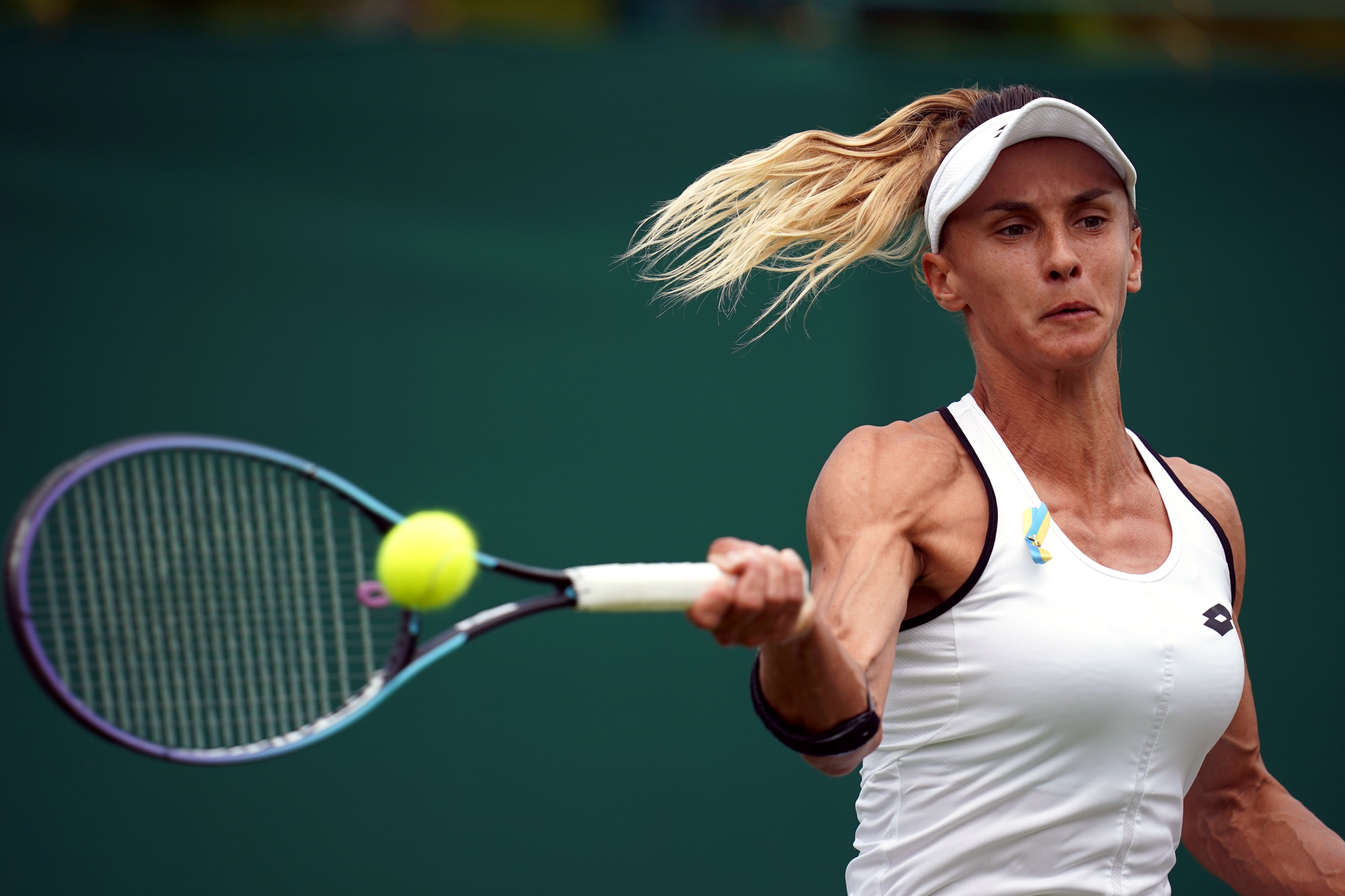 Lesia Tsurenko of Ukraine wore a yellow and blue ribbon in support of her war-torn country during a second round match with compatriot Anhelina Kalinina (John Walton/PA)